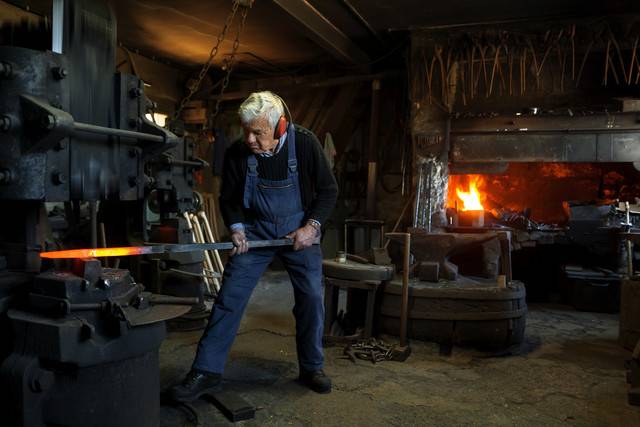 Germany, Bavaria, Josefsthal, senior blacksmith at work in historic blacksmith's shop
Royalty free image