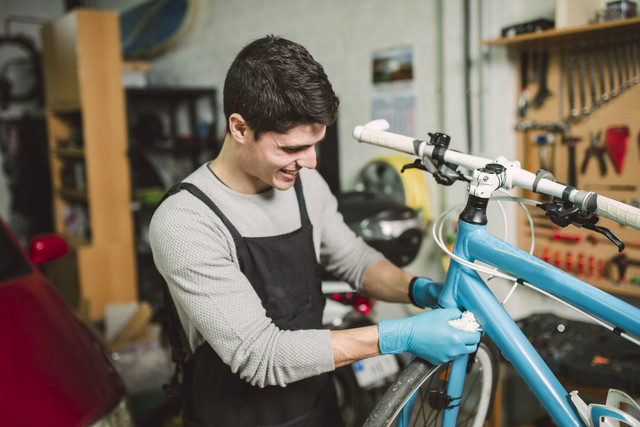 Mechanic repairing a bicycle in his workshop
Royalty free image