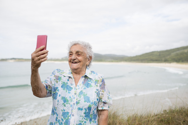 Happy senior woman taking selfie on the beach
Royalty free image