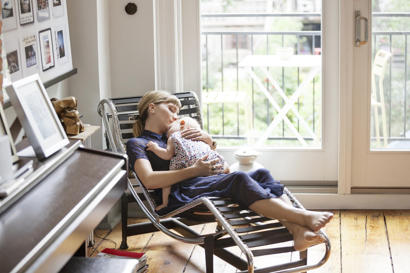 Mother and baby girl sleeping on lounge chair at home
Royalty free image