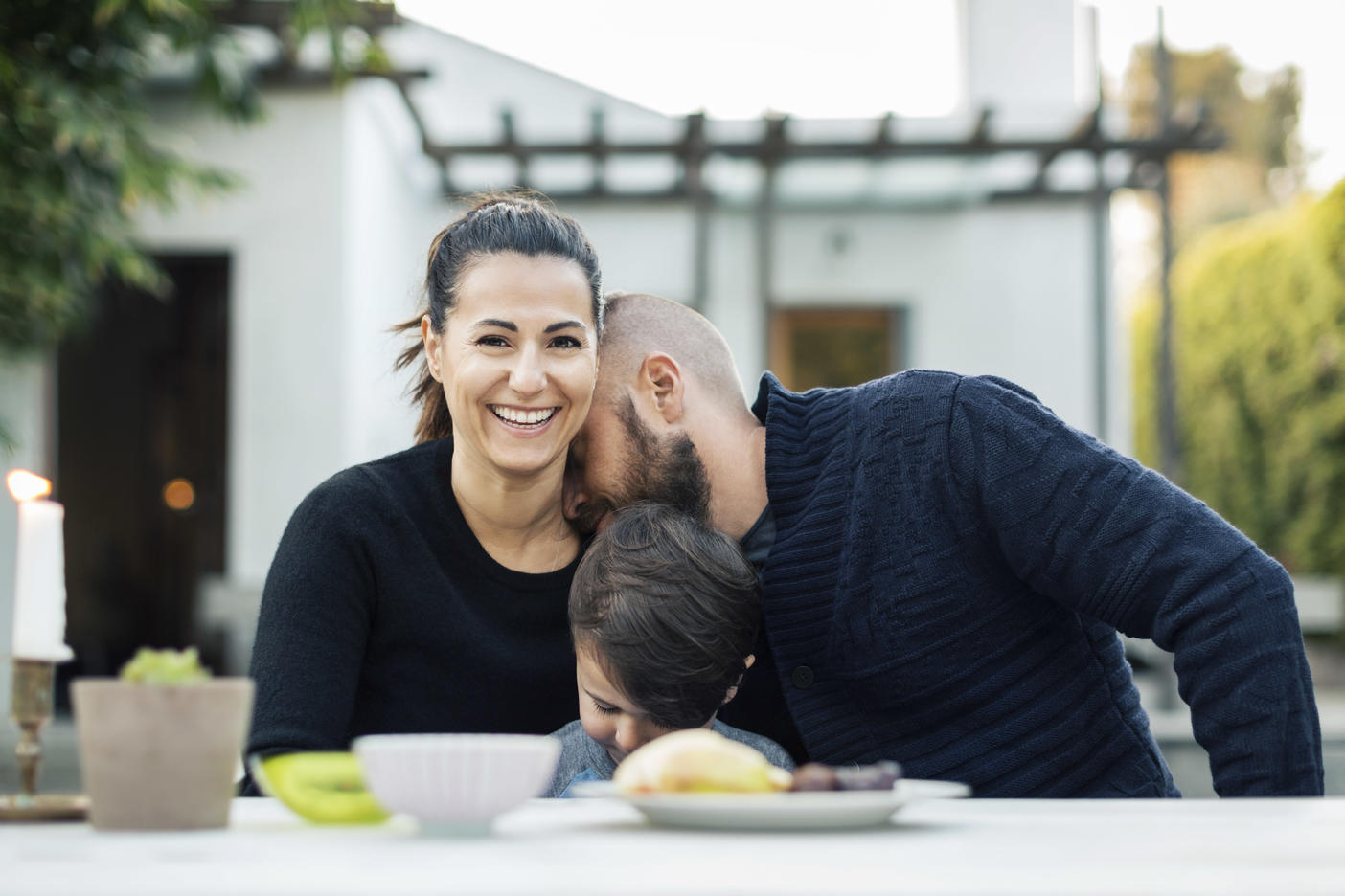 Portrait of happy woman sitting with family at yard Royalty free image Portrait of happy woman sitting with family at yard
Royalty free image