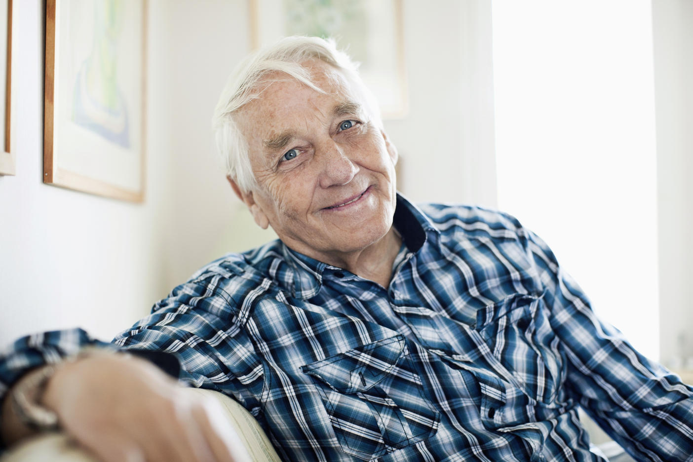 Portrait of smiling elderly man sitting in living room Royalty free image Portrait of smiling elderly man sitting in living room
Royalty free image