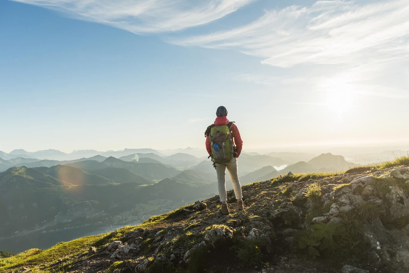 Hiker standing on mountain summit looking at view
Royalty free image