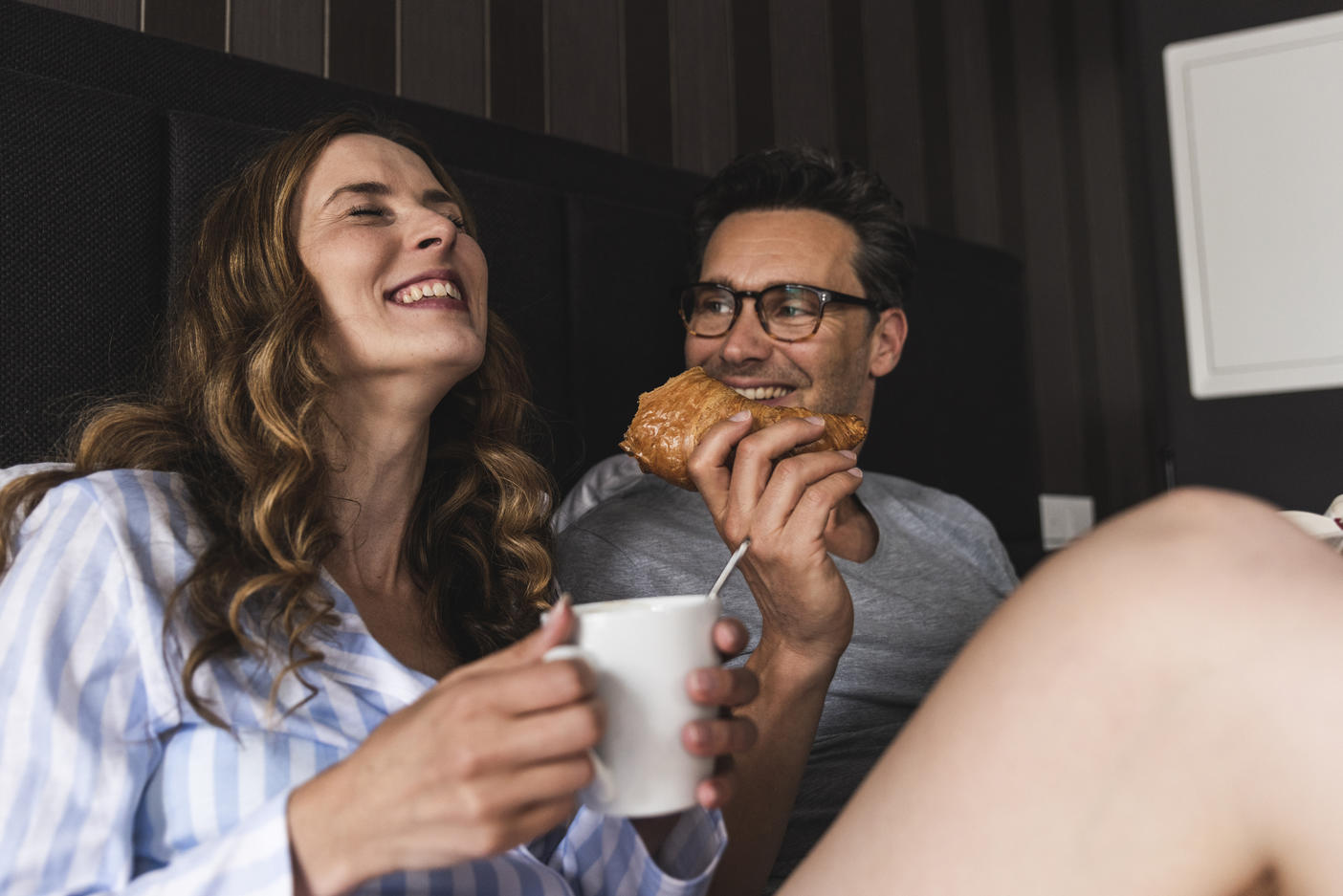 Happy couple having breakfast in bed at home
Royalty free image