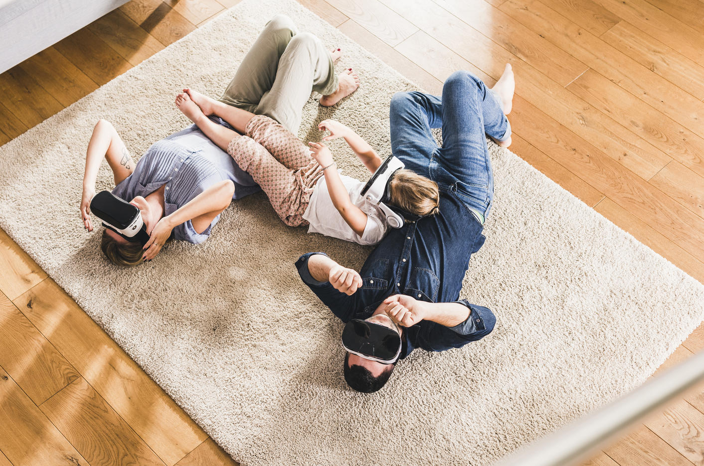 Family using VR goggles at home
Royalty free image