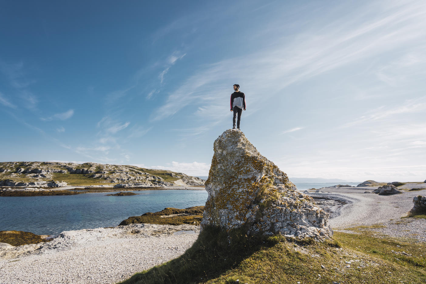 Finland, Lapland, man standing on top of a rock at the coast Royalty free image Finland, Lapland, man standing on top of a rock at the coastRoyalty free image