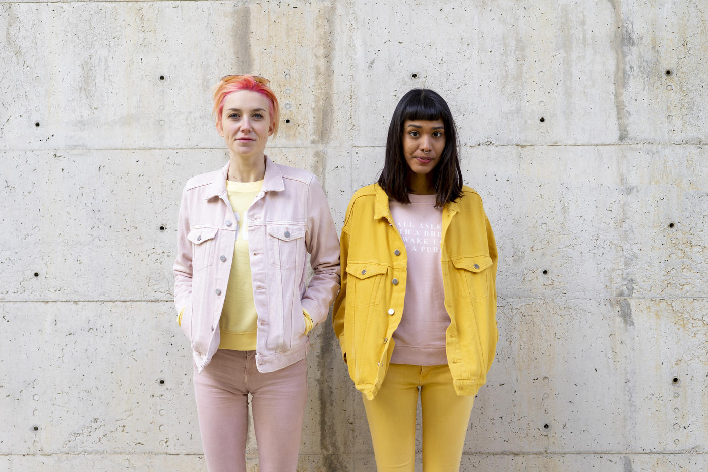 Two alternative friends having fun, wearing yellow and pink jeans clothes
Royalty free image