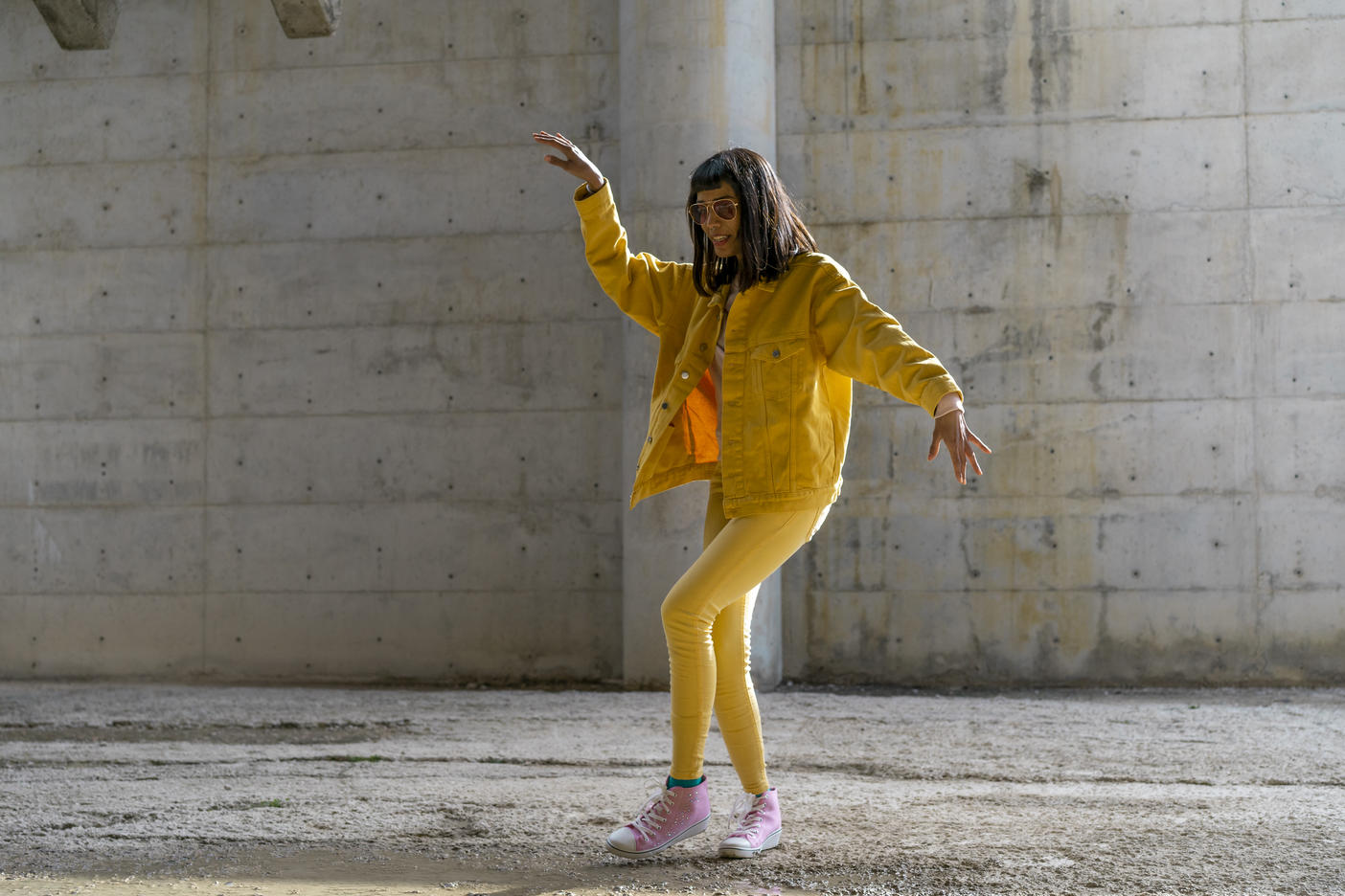Woman wearing yellow jeans clothes, dancing
Royalty free image