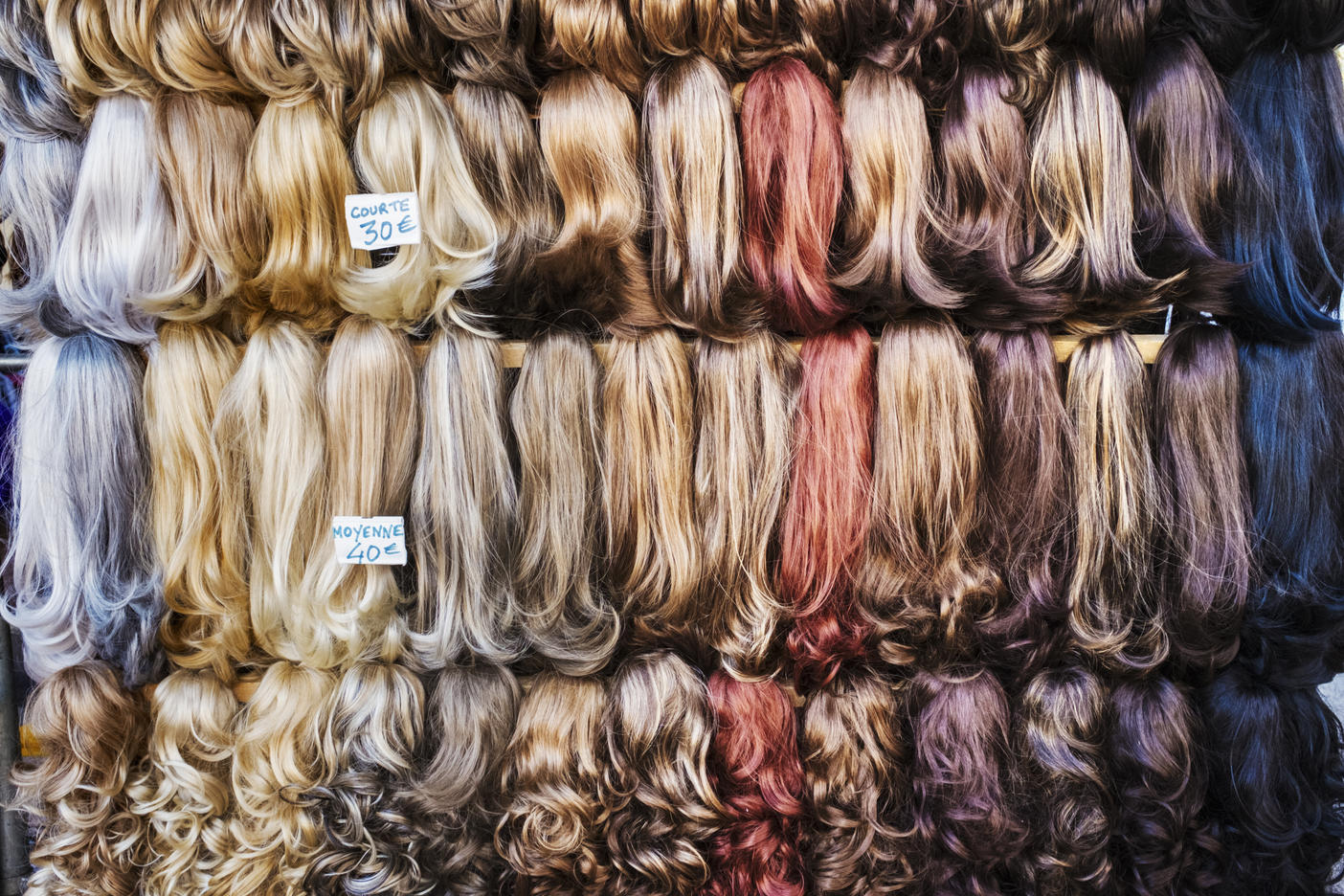 A display of hair extensions and hair pieces of different colours.
Royalty free image