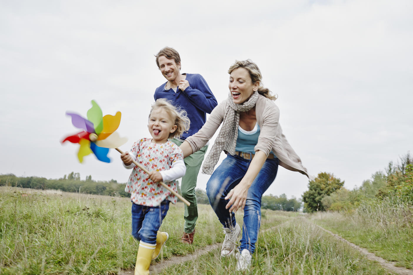 Family on a trip with daughter holding pinwheelRoyalty free image