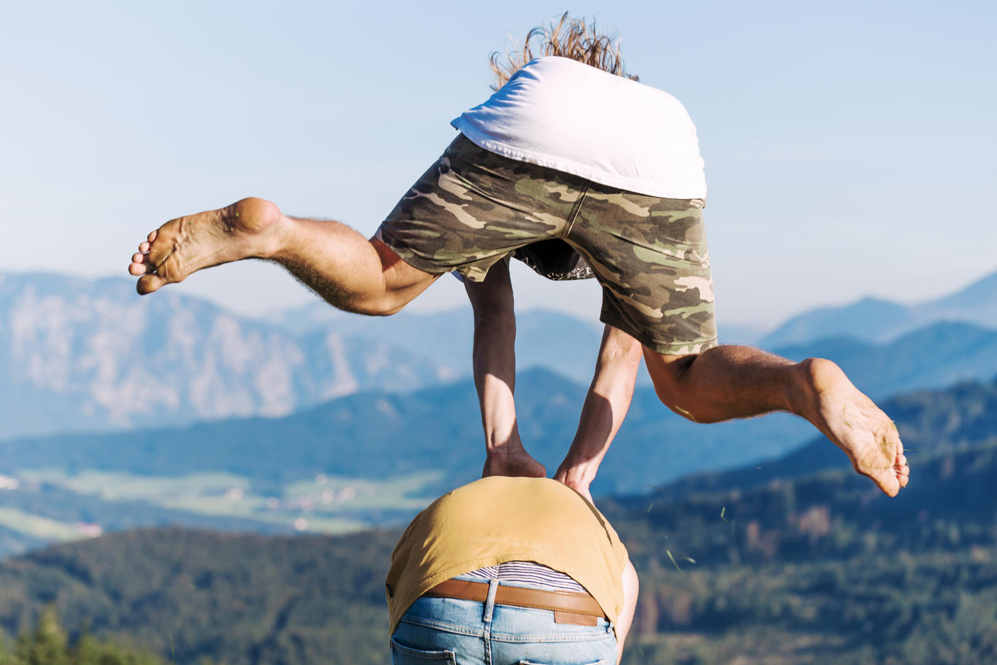 Austria, Mondsee, Mondseeberg, two young men leapfrogging
Royalty free image