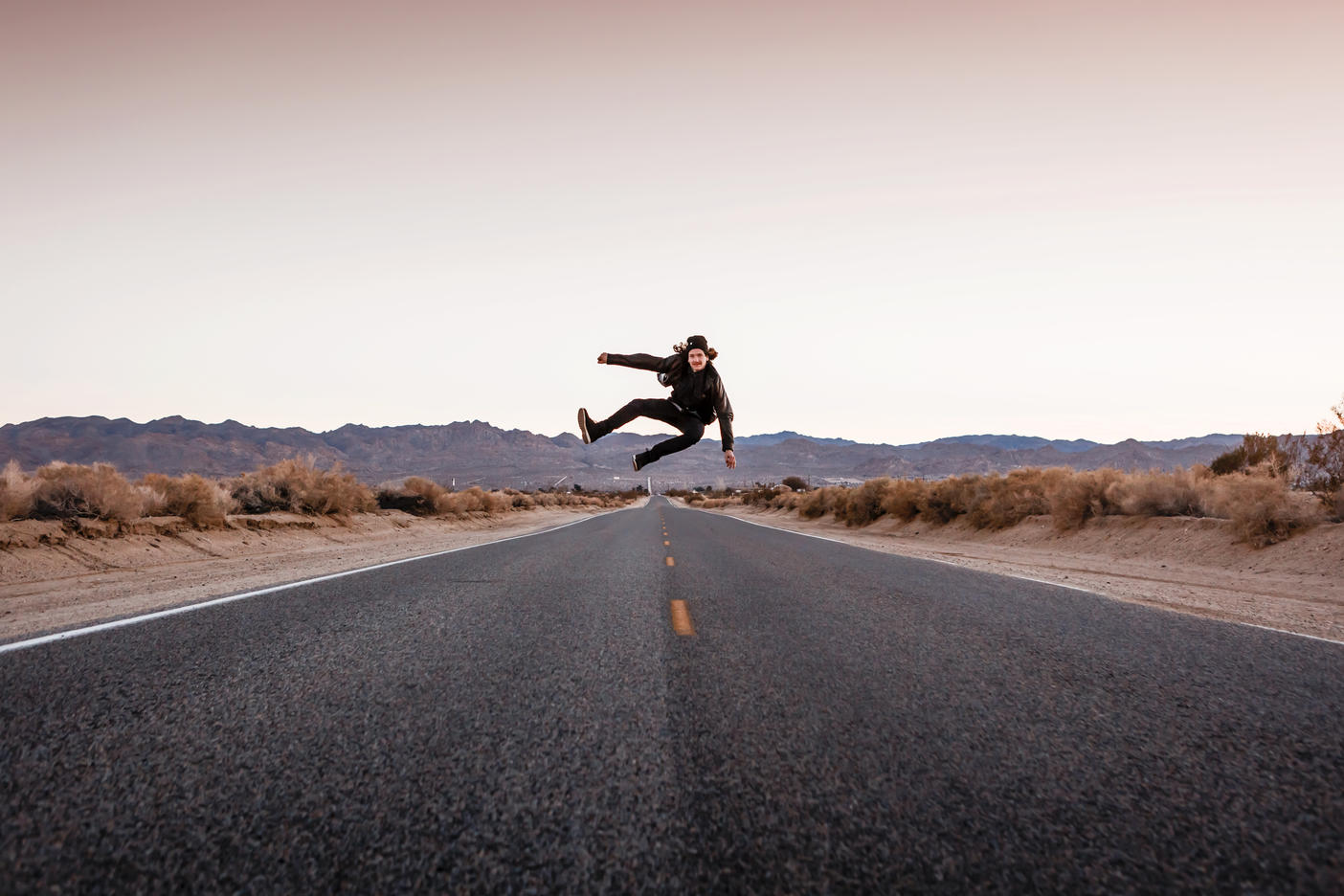USA, California, Joshua Tree, young man jumping on a road
Royalty free image
