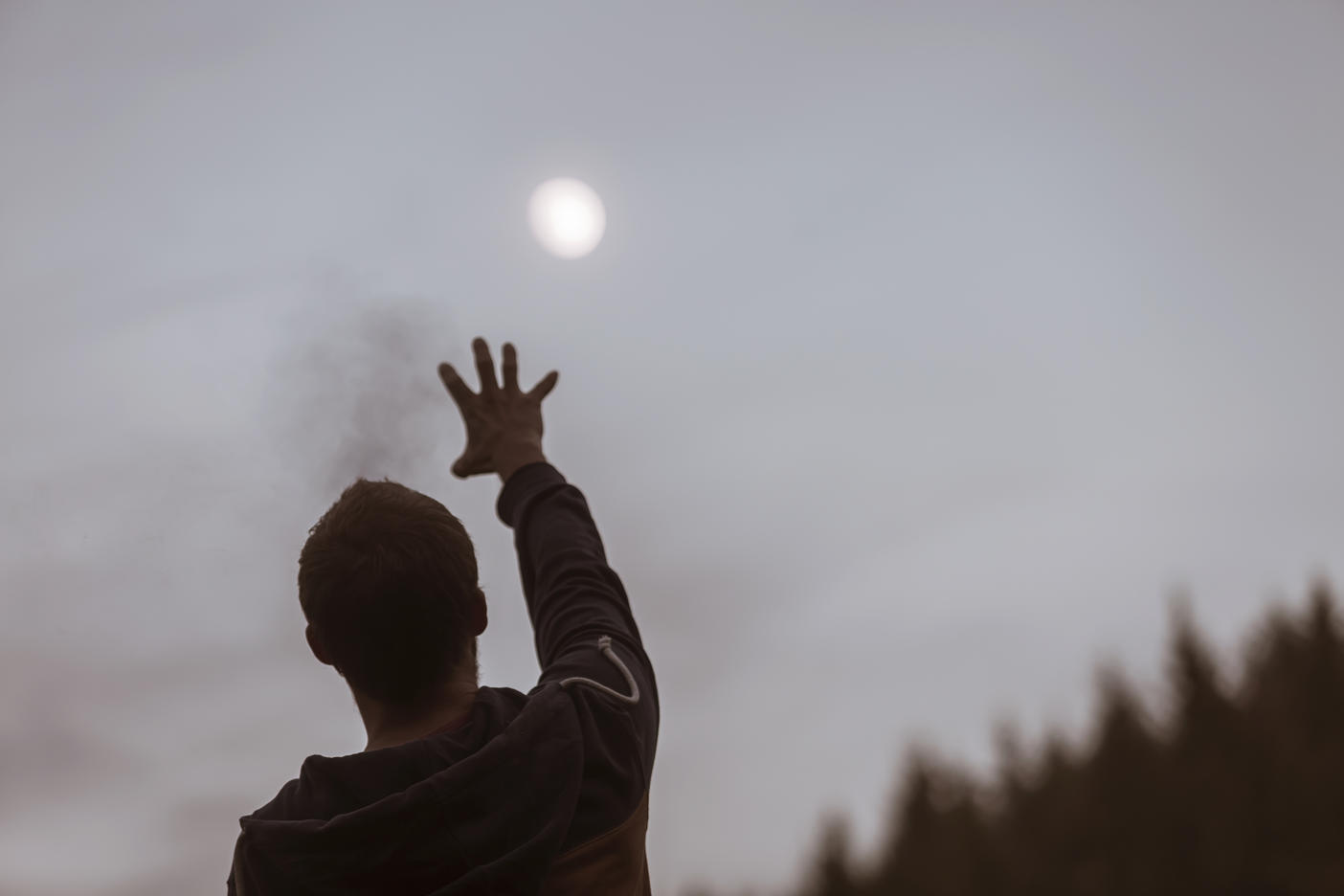 Young man reaching for the moon
Royalty free image