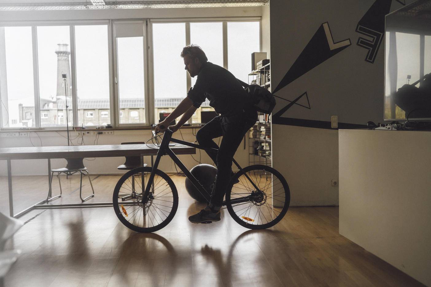 Man entering office with his bicycle
Royalty free image