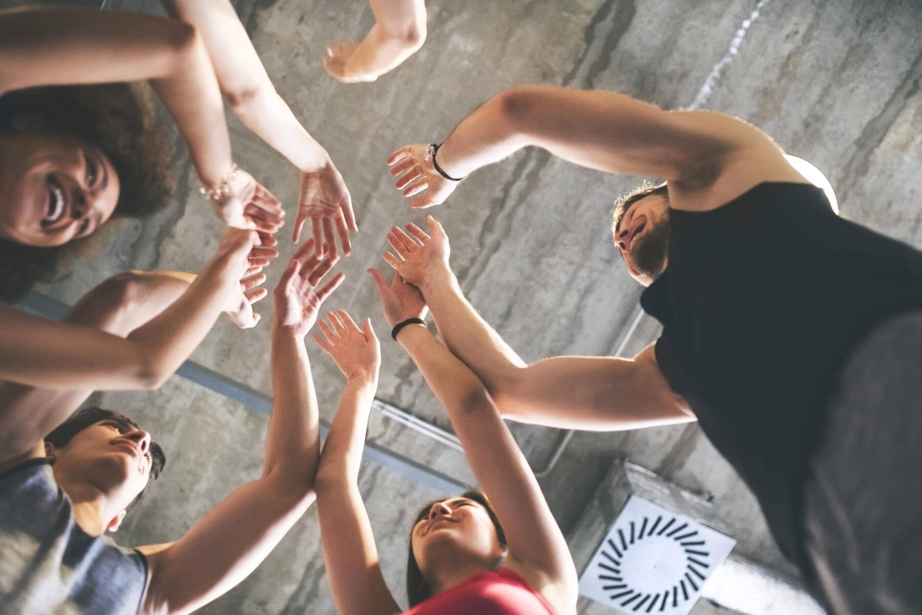 Group of young people huddling in gym
Royalty free image