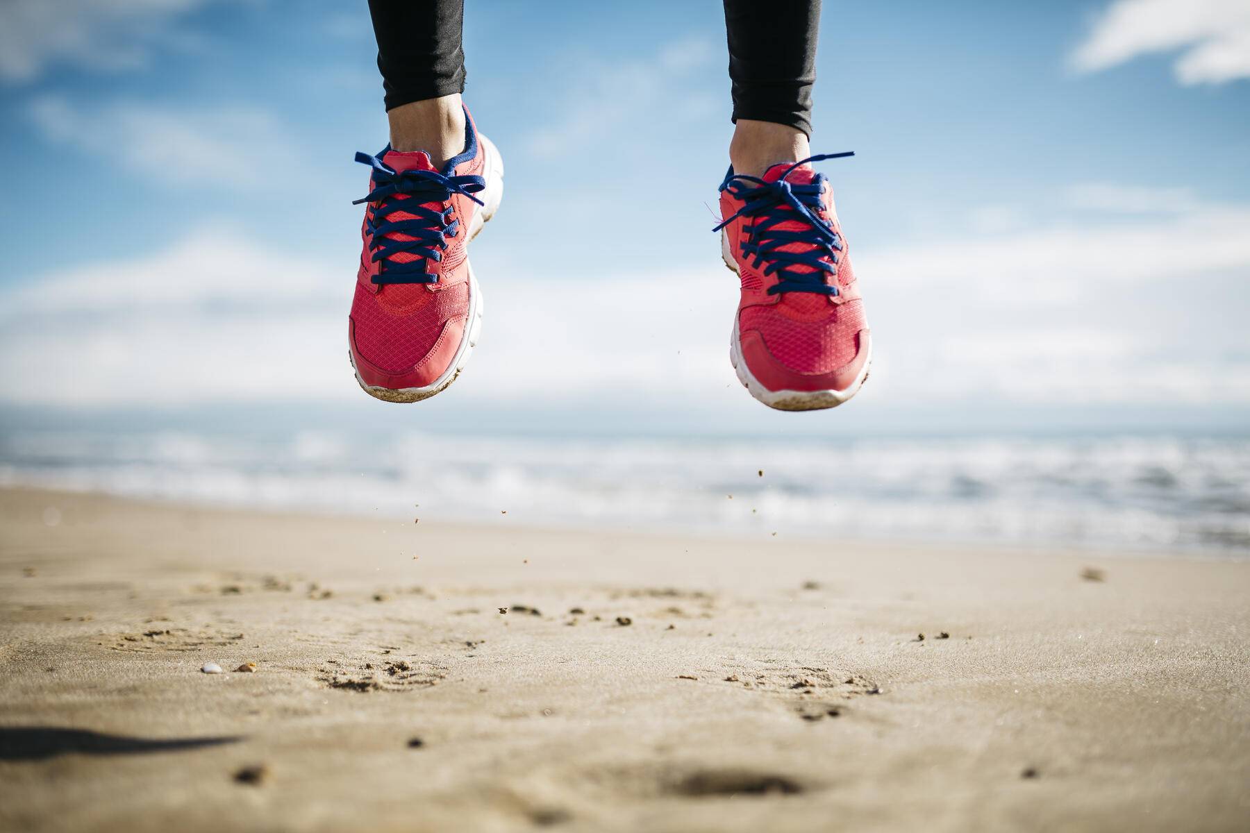 Feet of woman jumping on beach
Royalty free image