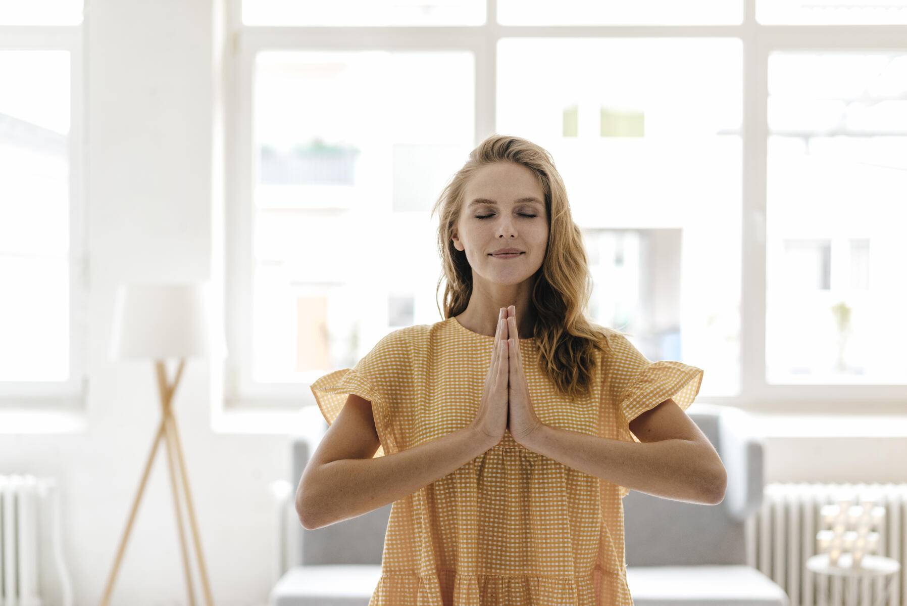 Young woman wearing a dress practising yoga
Royalty free image
