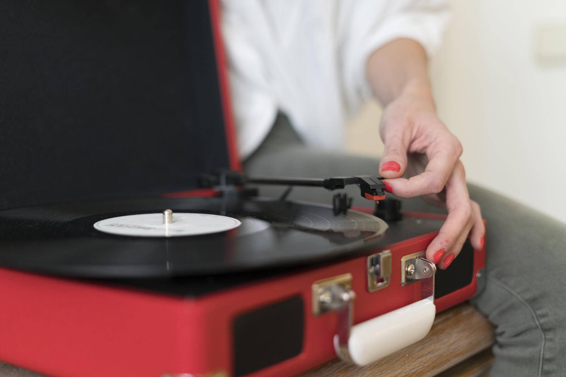 Woman using record player, close-up Royalty free image Woman using record player, close-up
Royalty free image