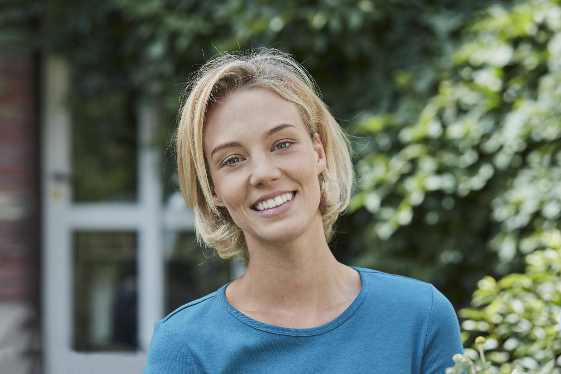Portrait of smiling woman in garden of her home
Royalty free image
