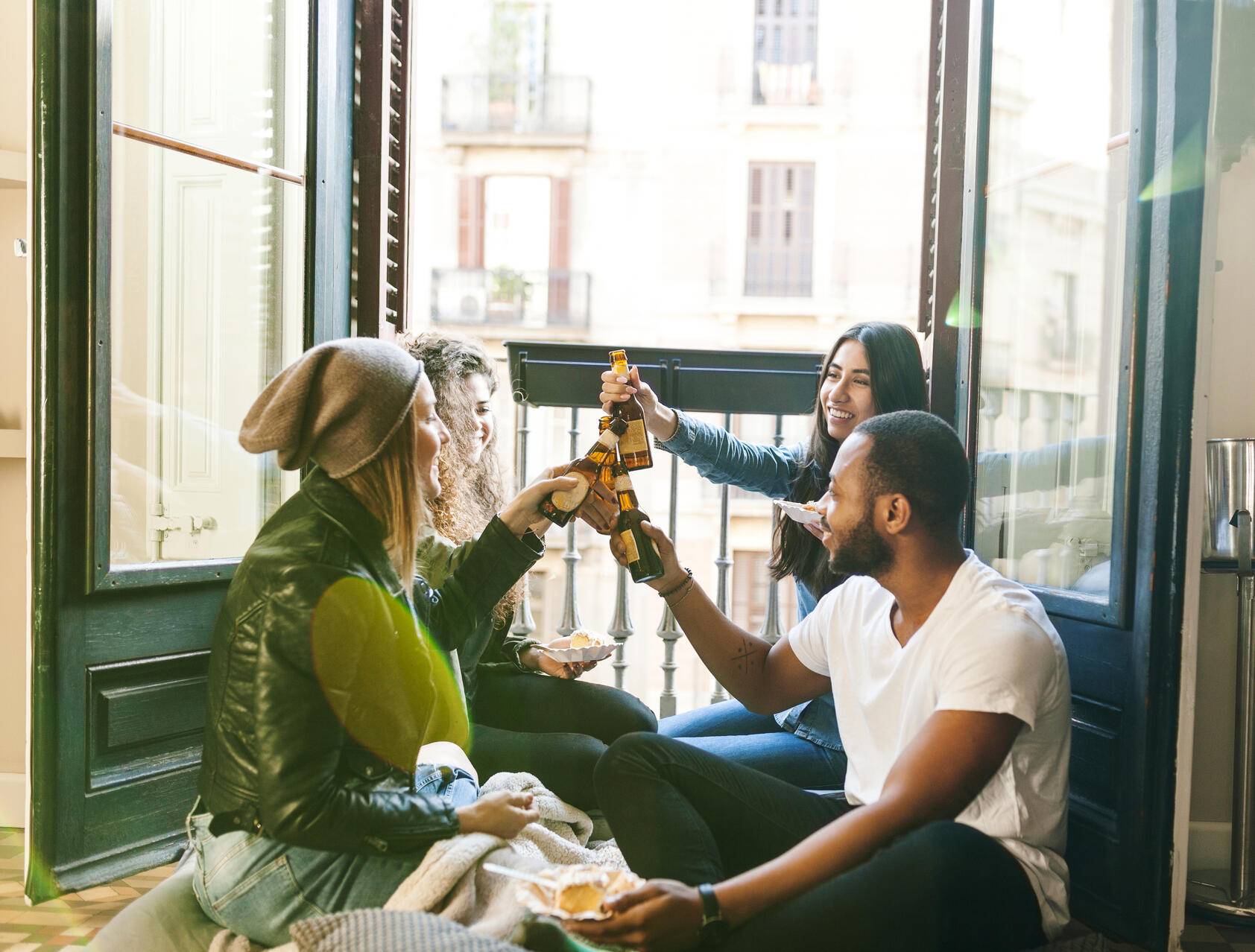 Four friends clinking beer bottles Royalty free image Four friends clinking beer bottles
Royalty free image