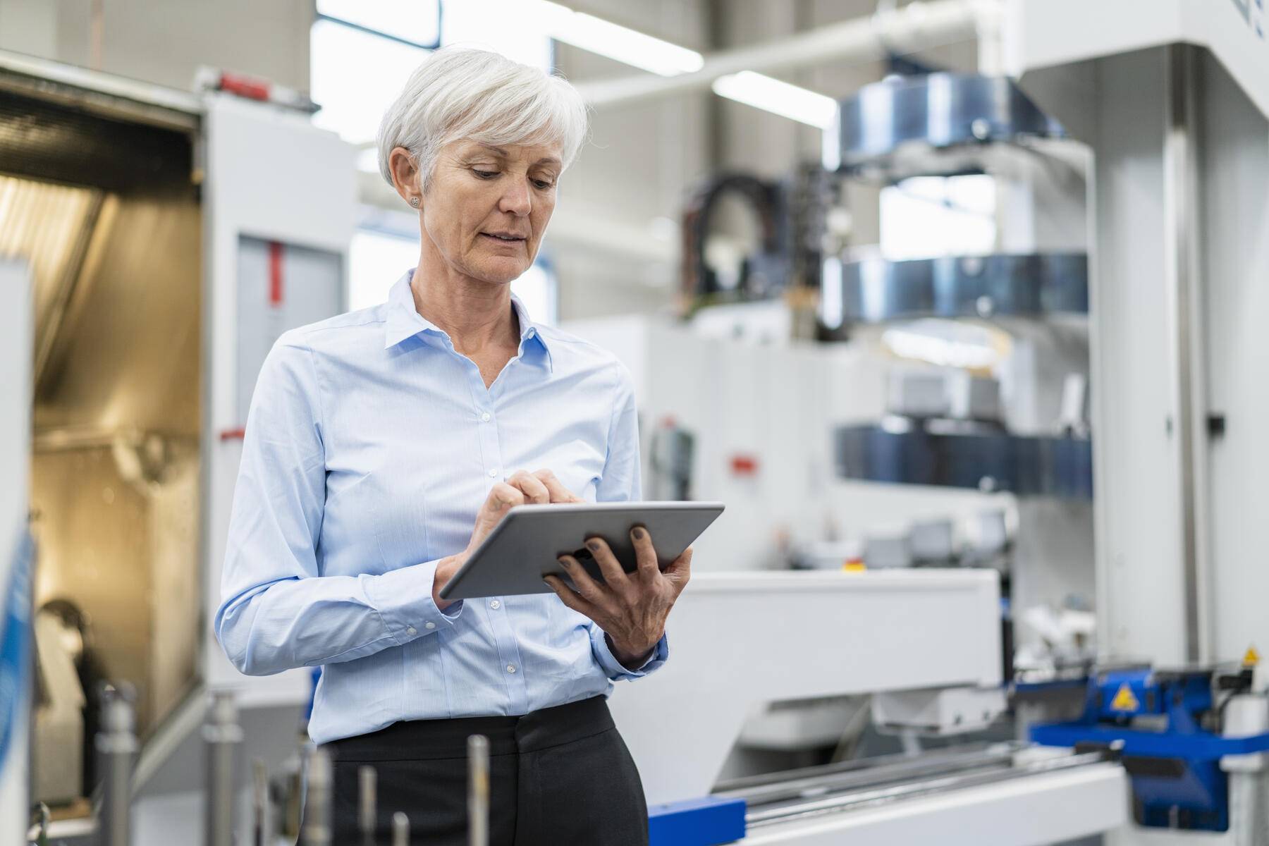 Senior businesswoman using tablet in a factory Royalty free image Senior businesswoman using tablet in a factory
Royalty free image