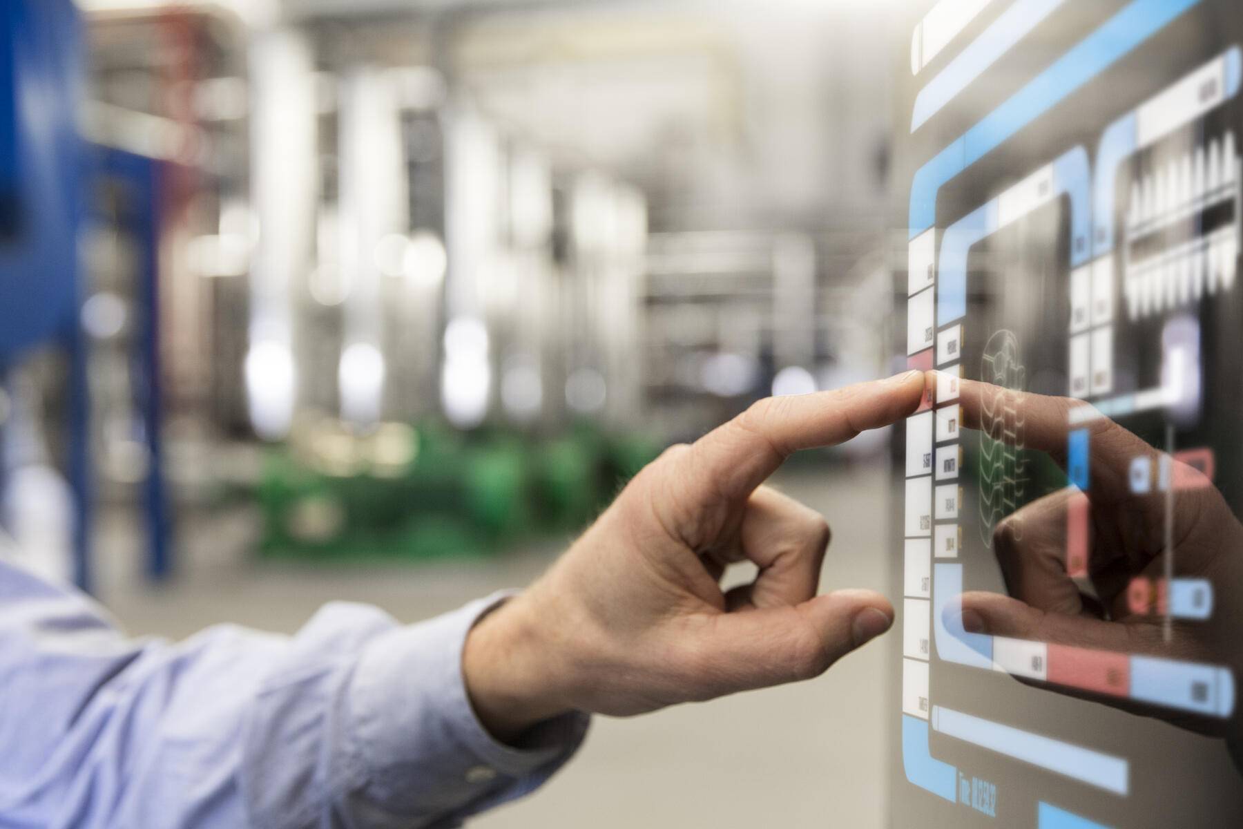 Man using touchscreen device in industrial plant Royalty free image Man using touchscreen device in industrial plant
Royalty free image