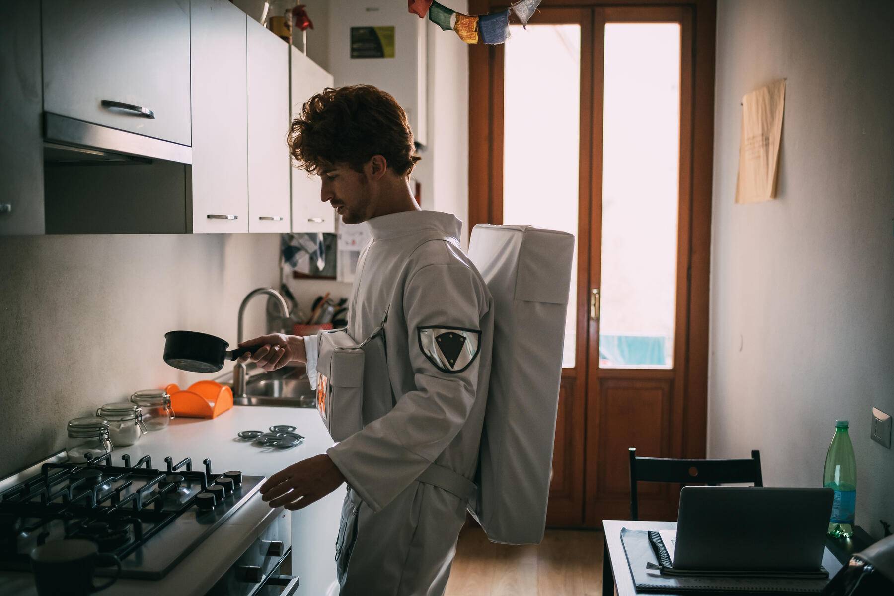 Astronaut cooking in kitchen
Royalty free image