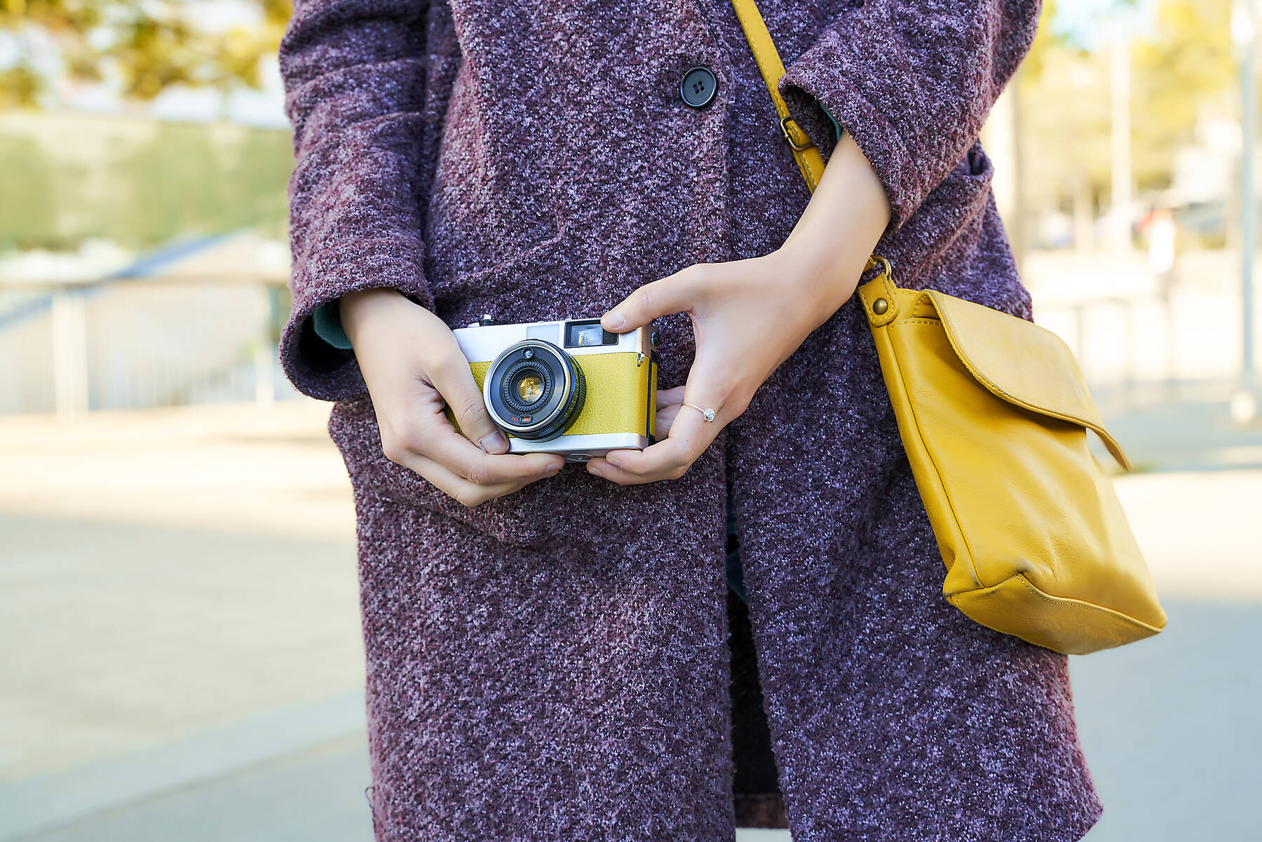 stock image, royalty-free, Close-up of woman holding a vintage analog camera