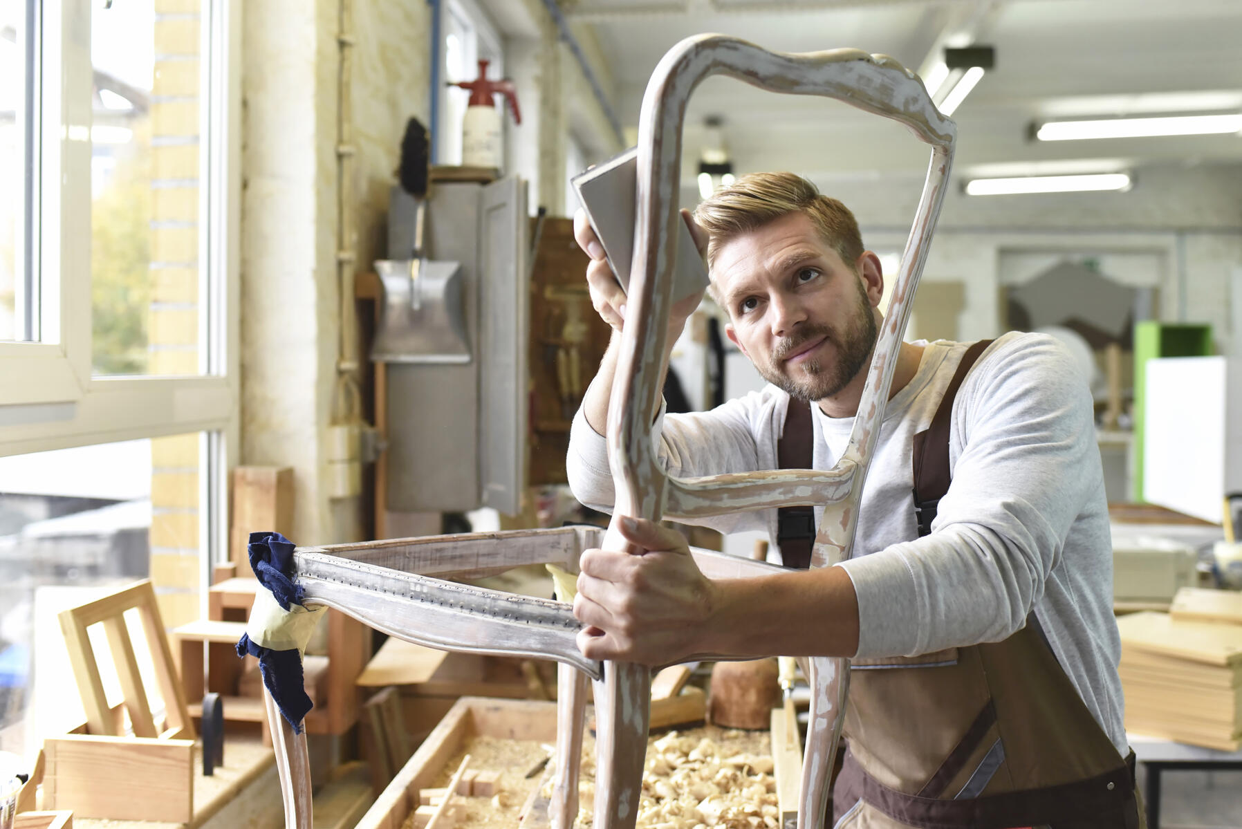 stock image, royalty-free, Carpenter restoring a wooden chair