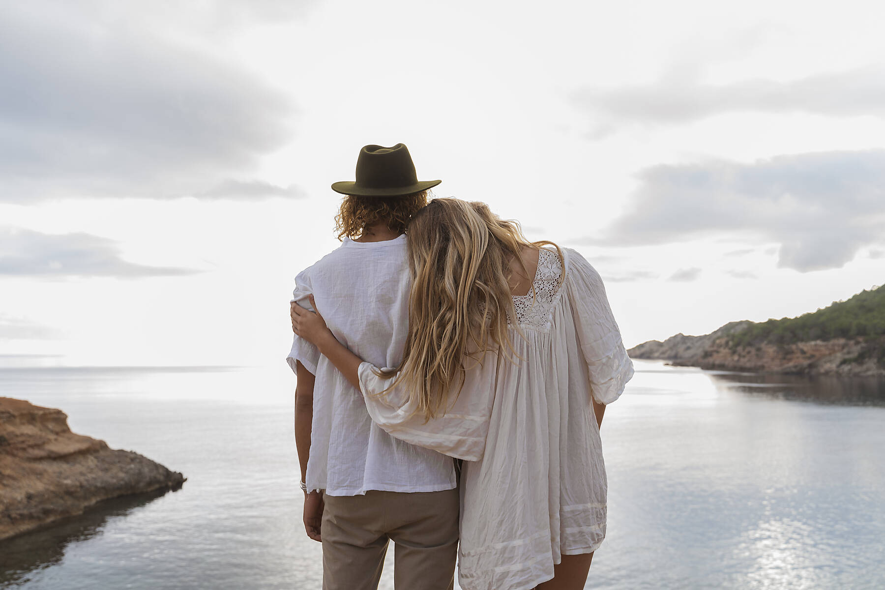 stock image, royalty-free, Back view of young couple in love standing in front of the sea, Ibiza, Balearic Islands, Spain