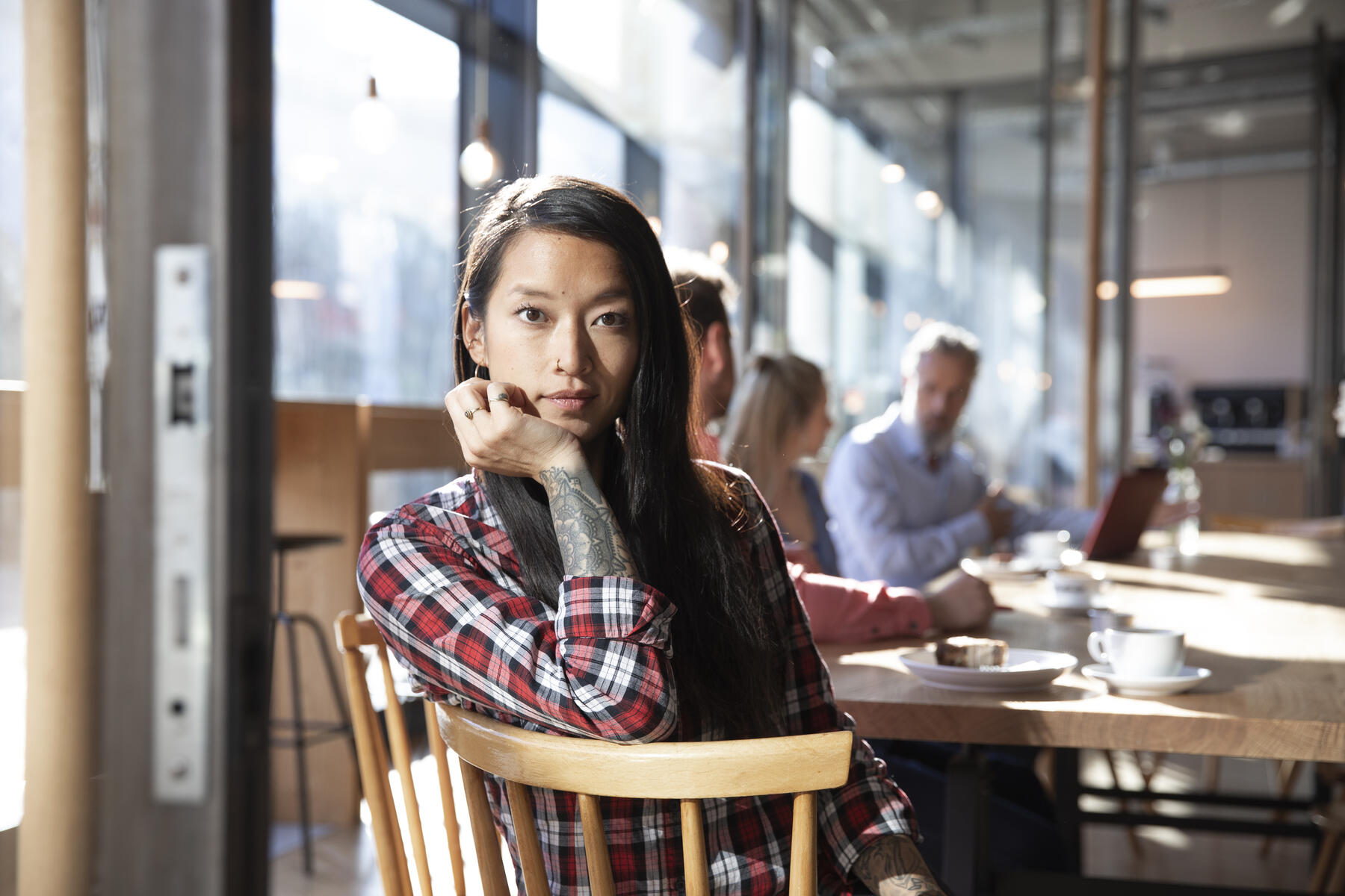 stock image, royalty-free, Portrait of woman with colleagues in a cafe