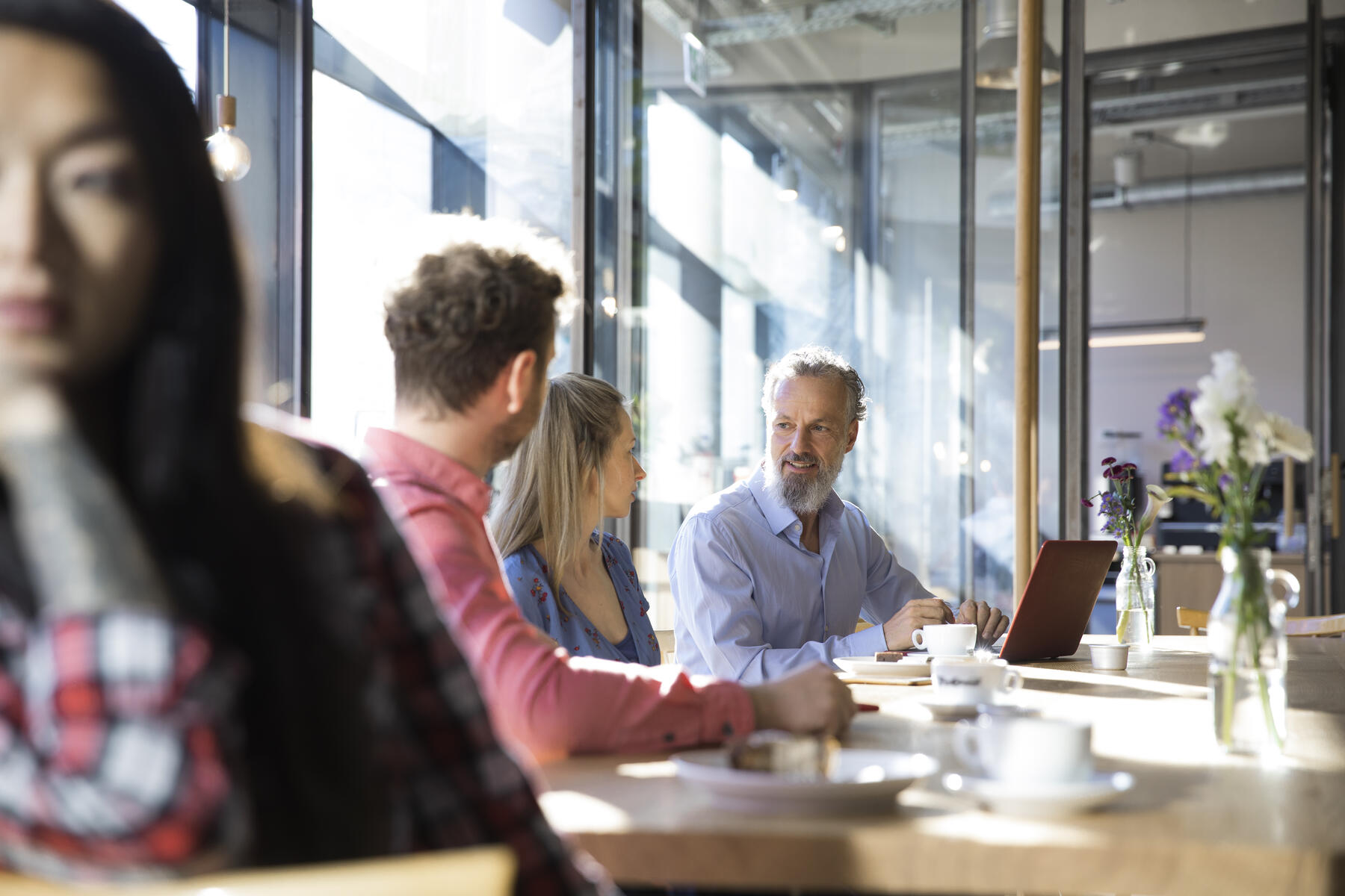 Stock image, royalty-free, Casual business people having a meeting in a cafe