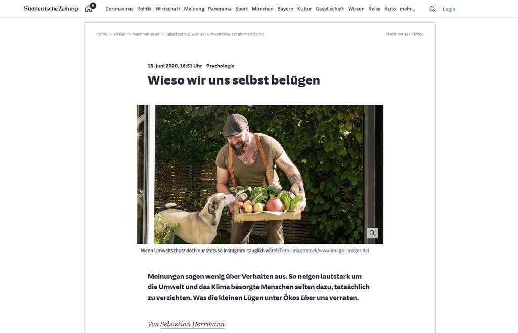 Mature man carrying crate with vegetables in his garden - REAF00385