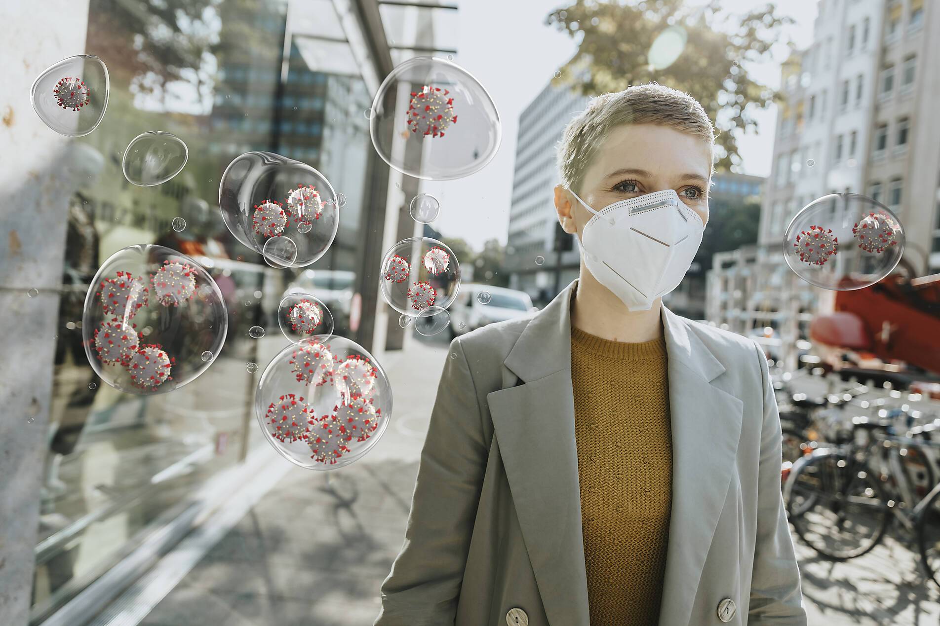 Stock image, royalty-free, Woman with mask walking through the city, coronaviruses around her
