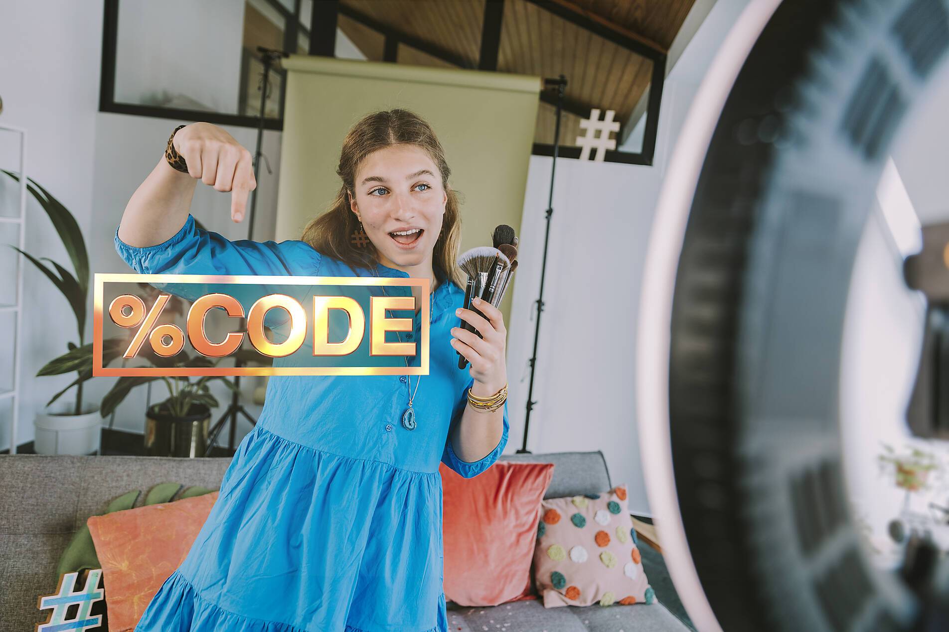 stock image, royalty-free, A blonde woman, an influencer, presents a makeup product and offers a promo code