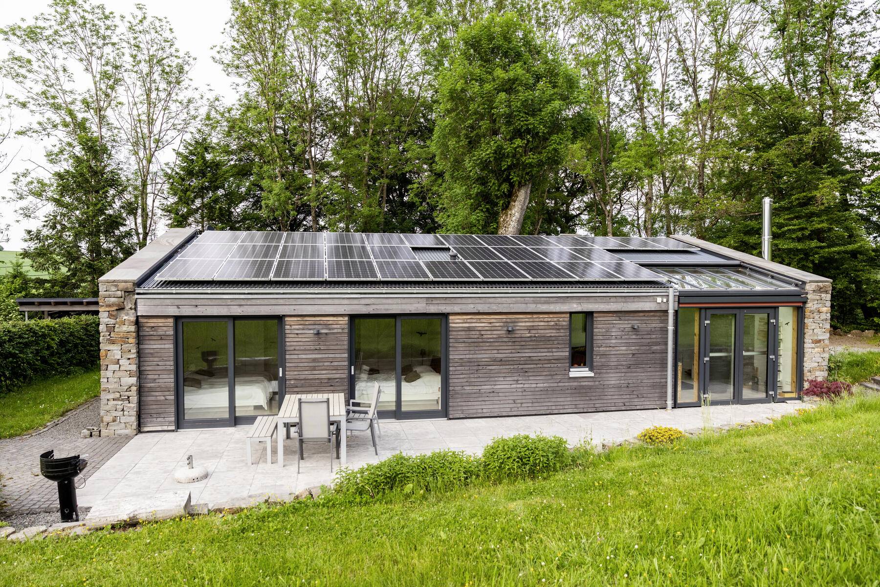 Stock Image, royalty-free, Detached house with solar panels on the roof