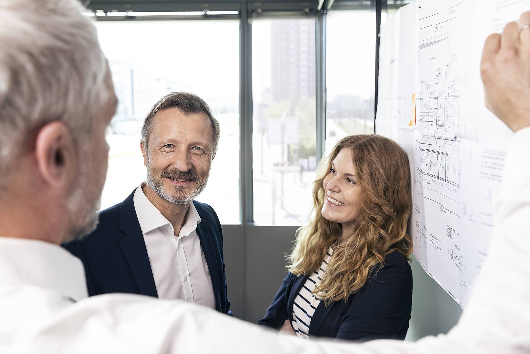 stock image, royalty-free, Male and female design professional discussing over business strategy in office