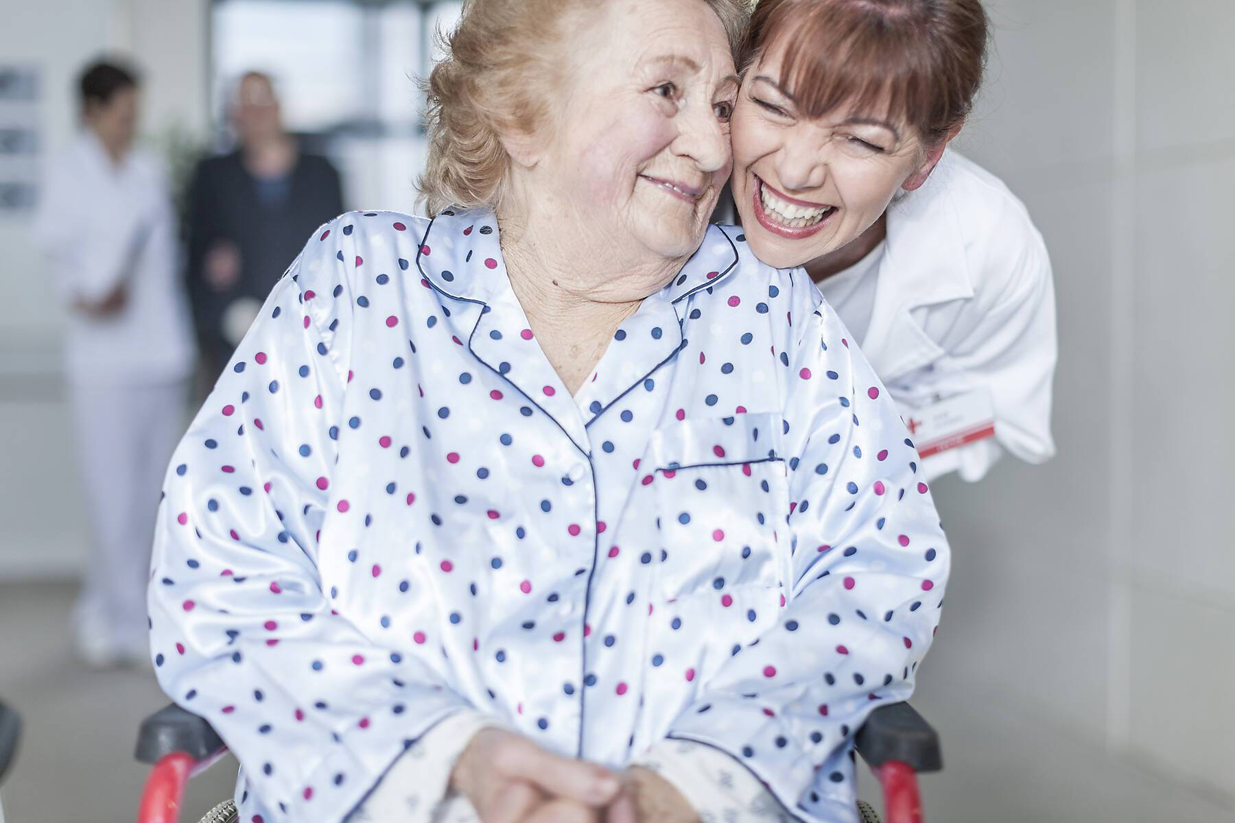 stock image, royalty-free, Doctor caring for elderly patient in wheelchair