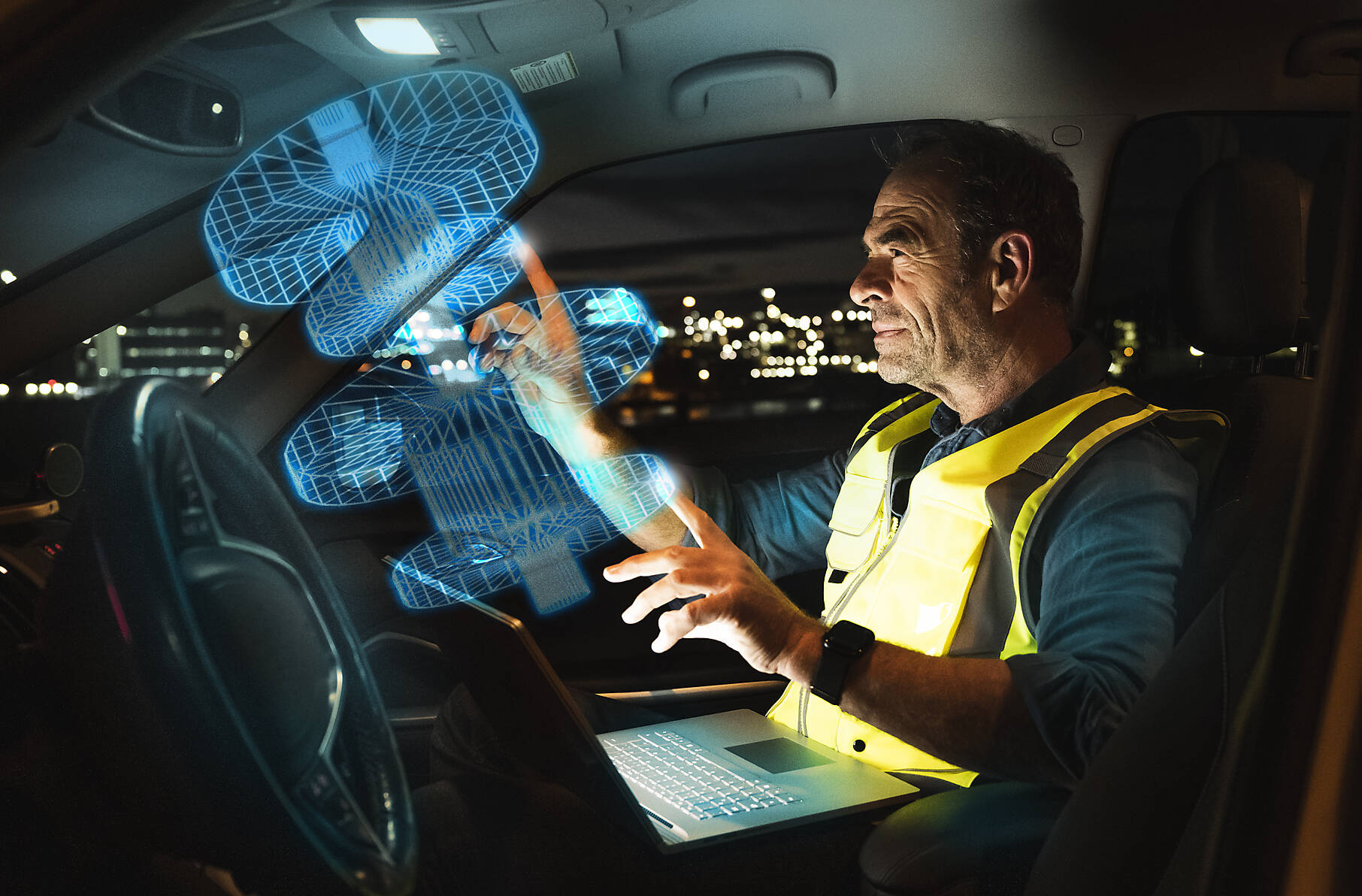 stock image, royalty-free, Engineer working on digitalized graphs in car