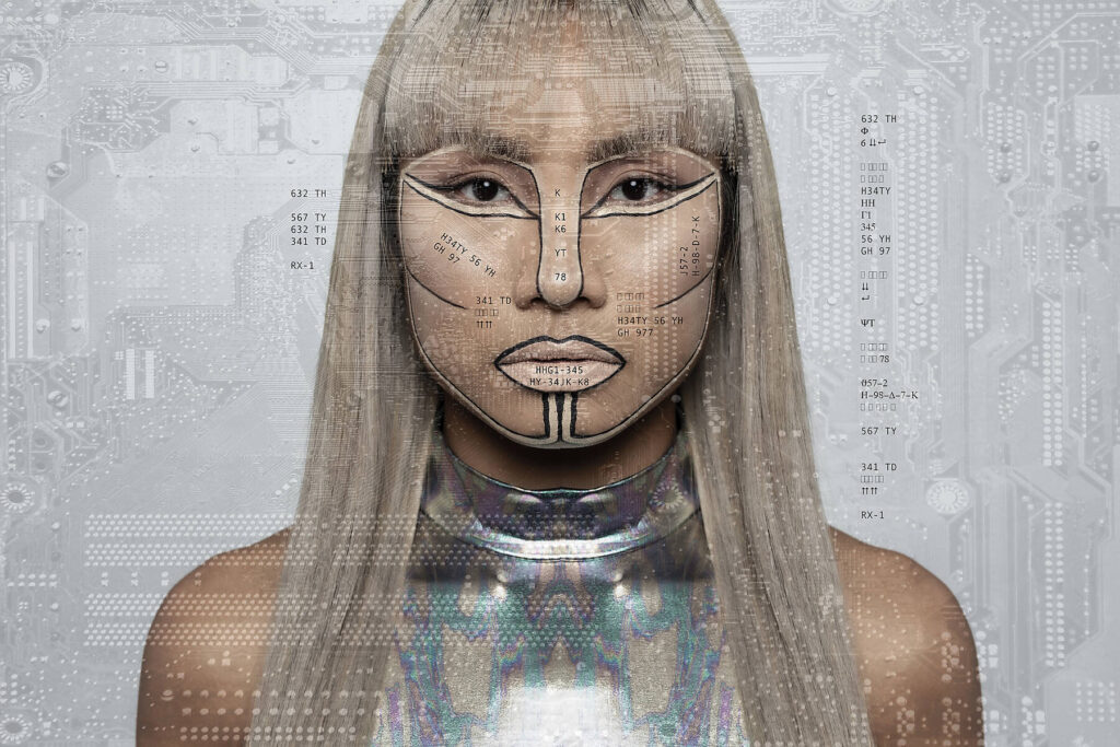 stock image, royalty-free, Robotic woman with silver bodysuit over circuit board