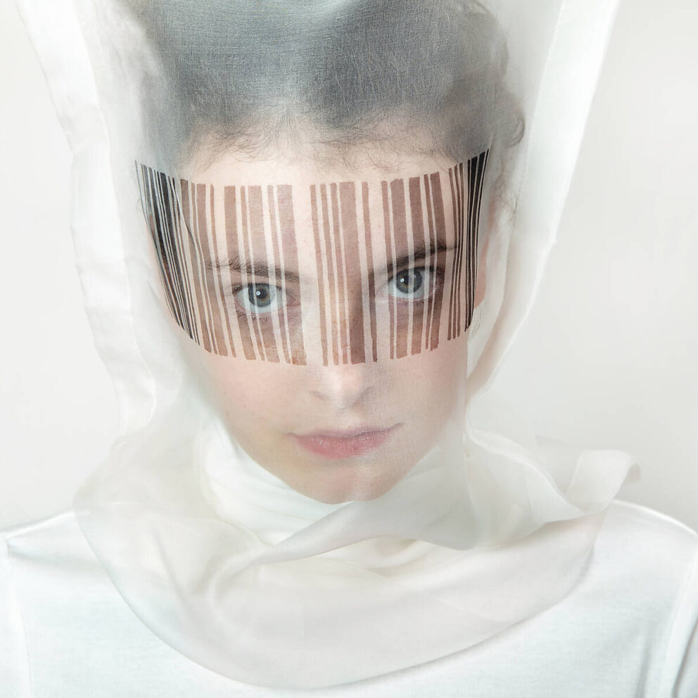stock image, royalty-free, Portrait of young woman wearing transparent mask with bar code