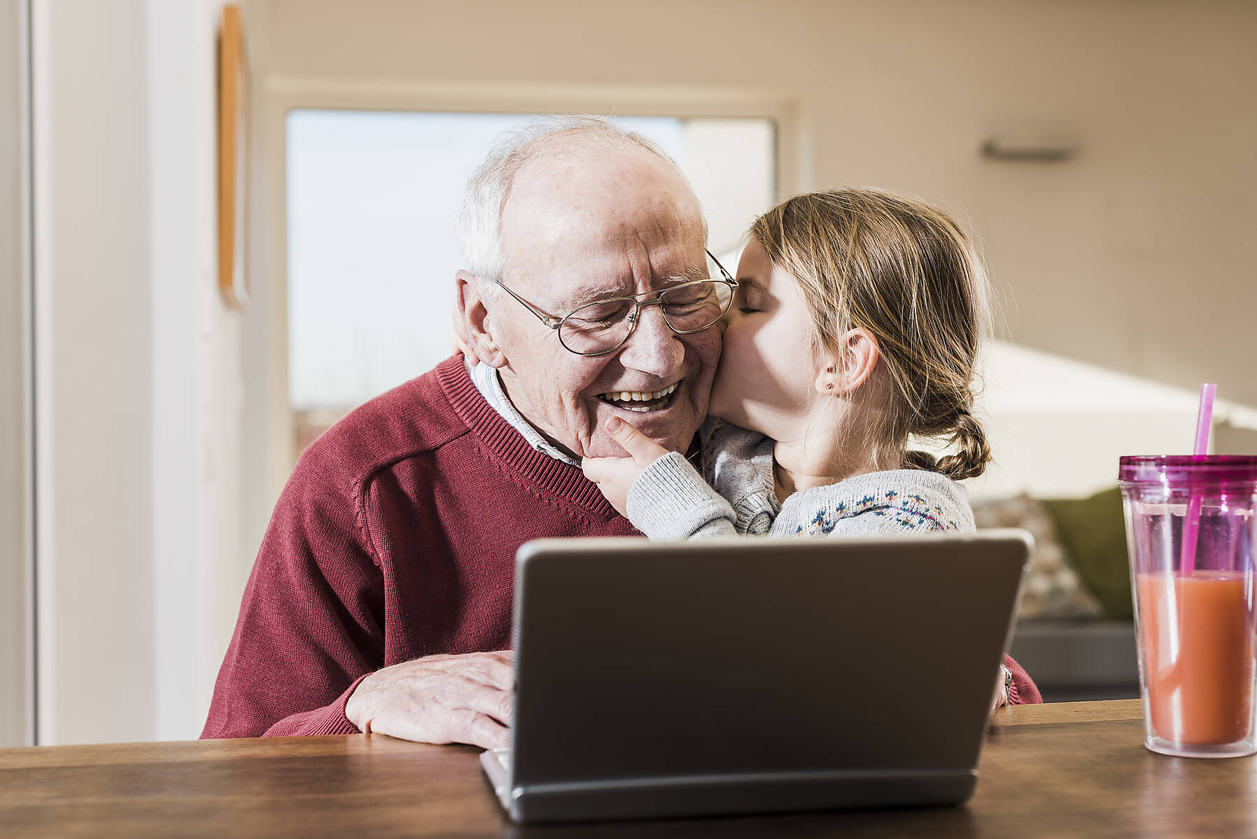 stock image, royalty-free, Grandfather and granddaughter using laptop together