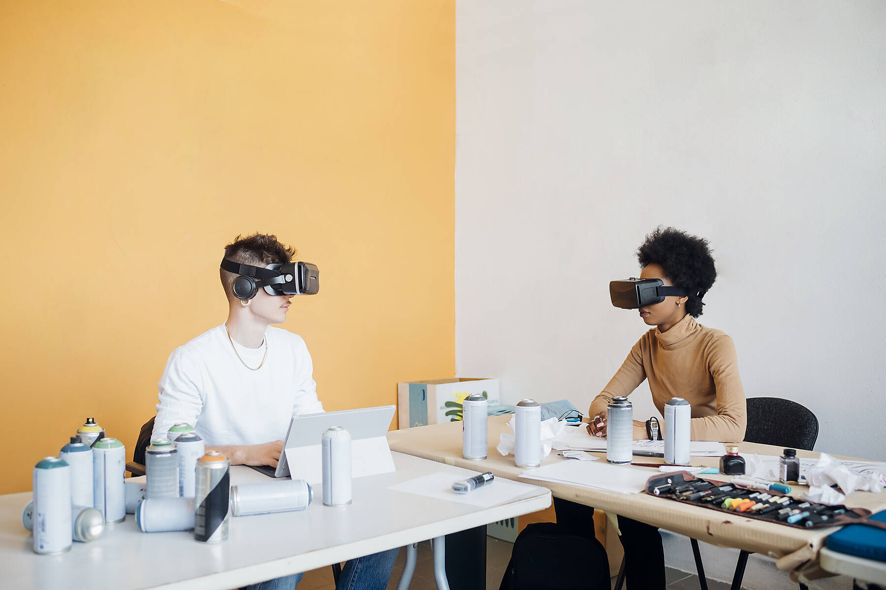 Young multiethnic couple working together in their studio using 3d viewer, Stock image, royalty-free