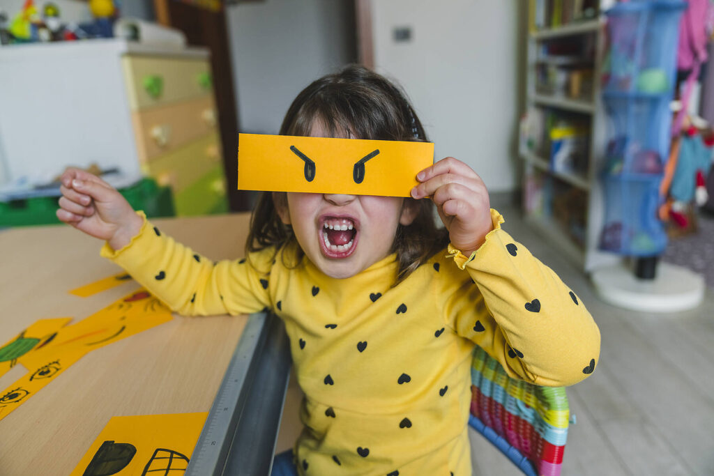 Stock image, royalty-free, Italy, Tuscany, Child Playing with Emoticon Cards