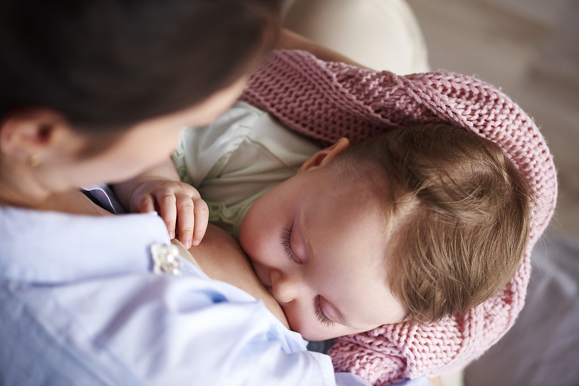 Stock image, royalty-free, Mother breastfeeding her baby