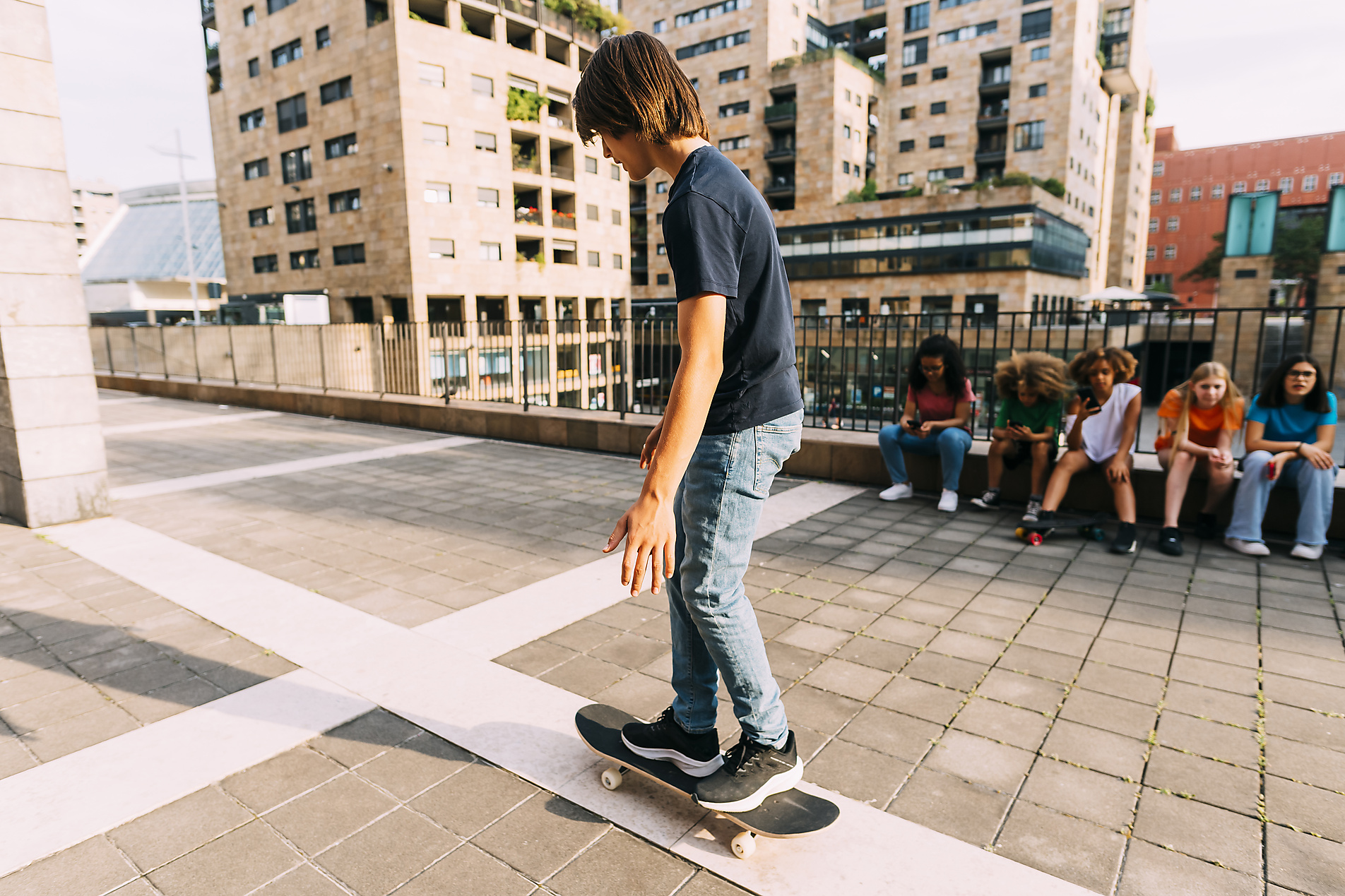 Stock image, royalty-free, Boy skateboarding park lot on sunny day, Summer images, Youth, Friends, diversity