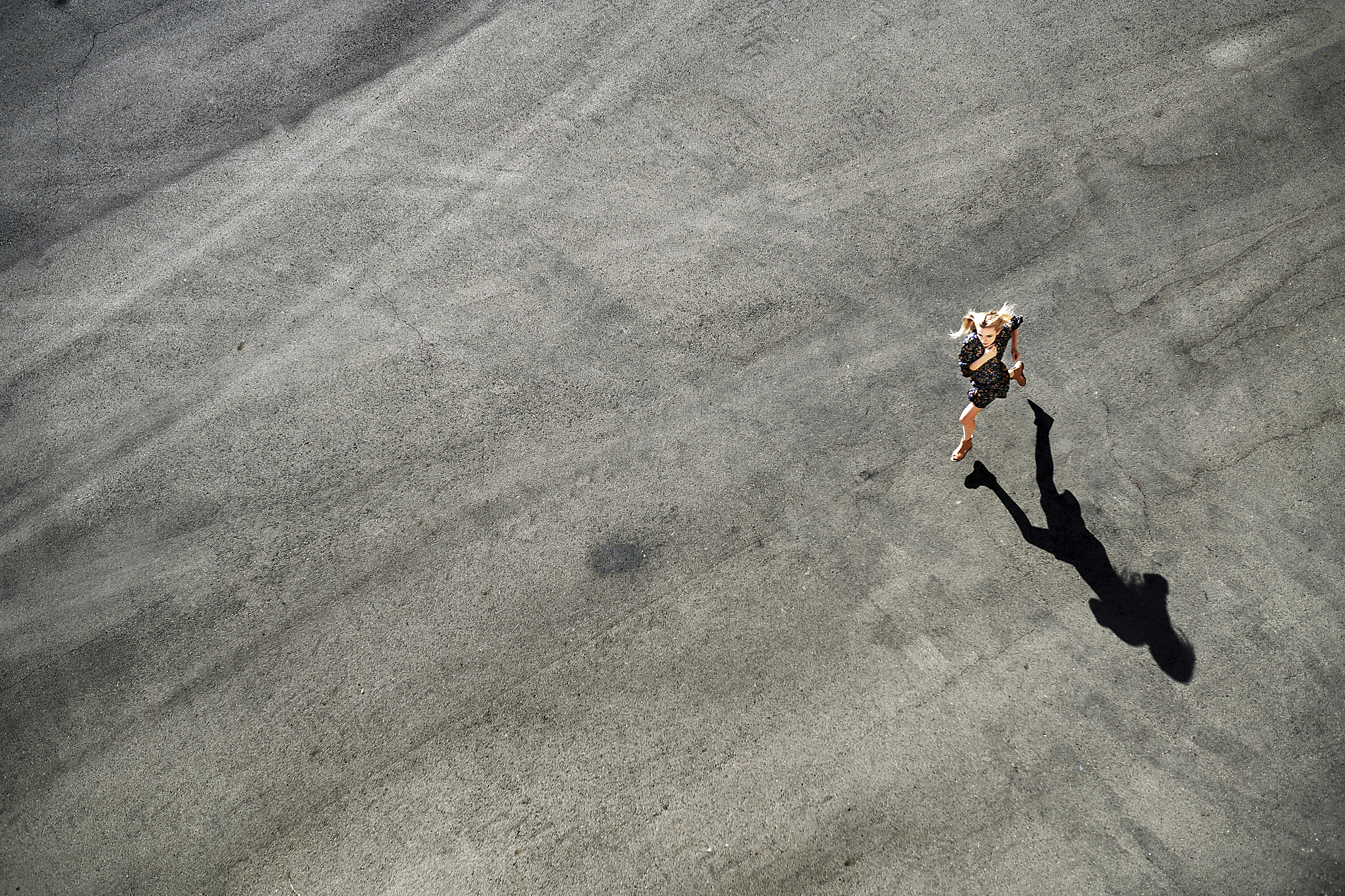 stock image, royalty-free, Woman running on road during sunny day