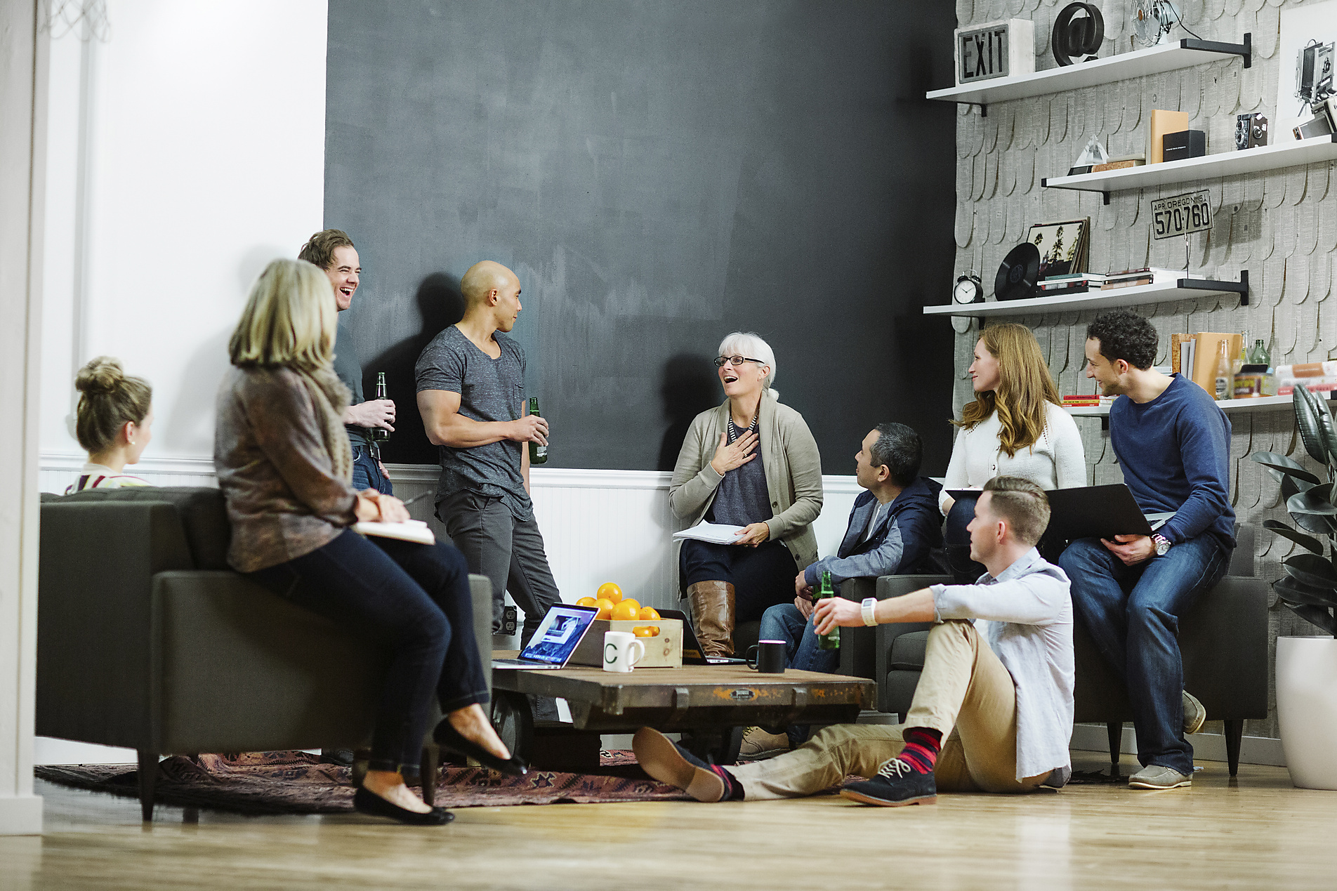 Stock image, royalty-free, Business people discussing while relaxing in office, new work