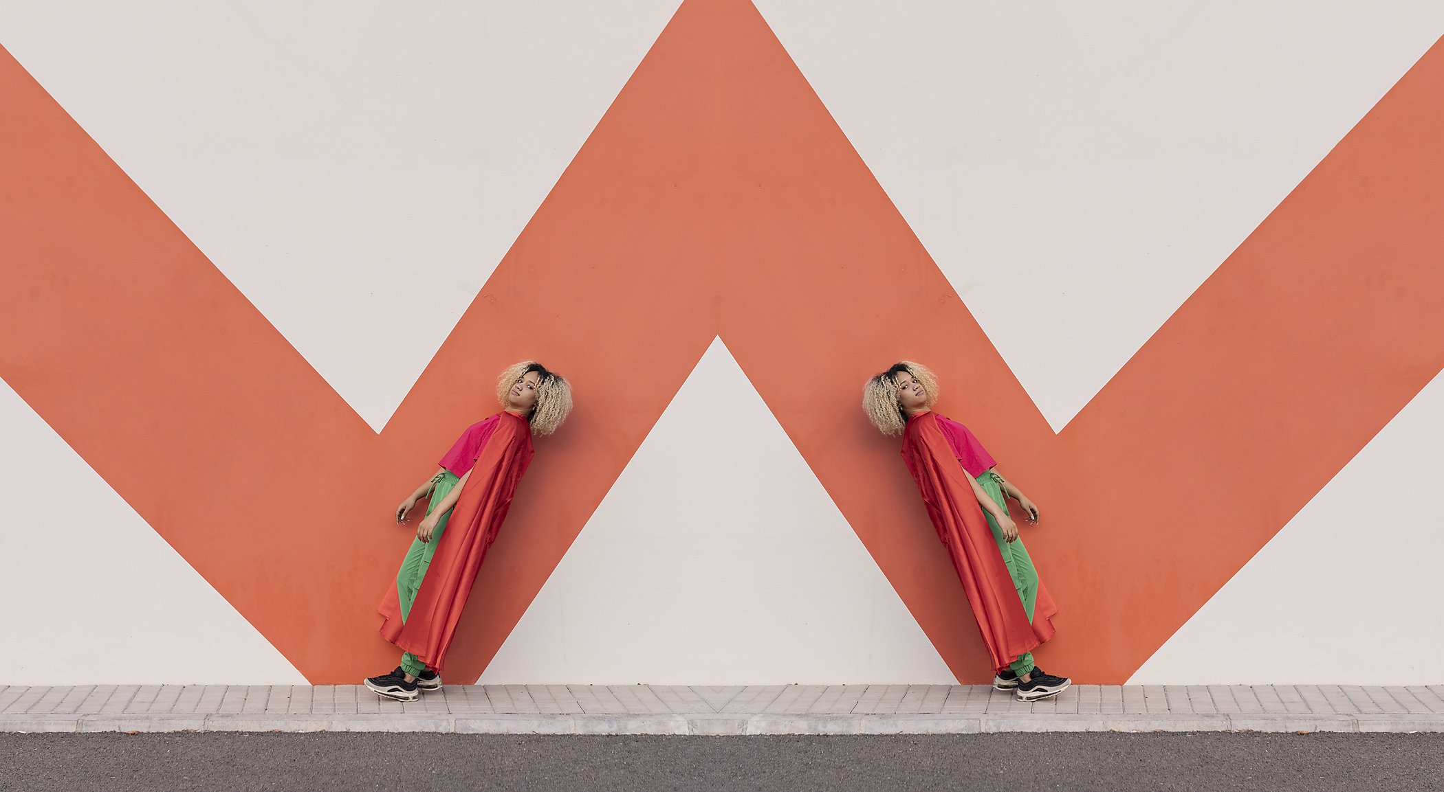 stock image, royalty-free, Multiple image of woman wearing cape leaning on wall