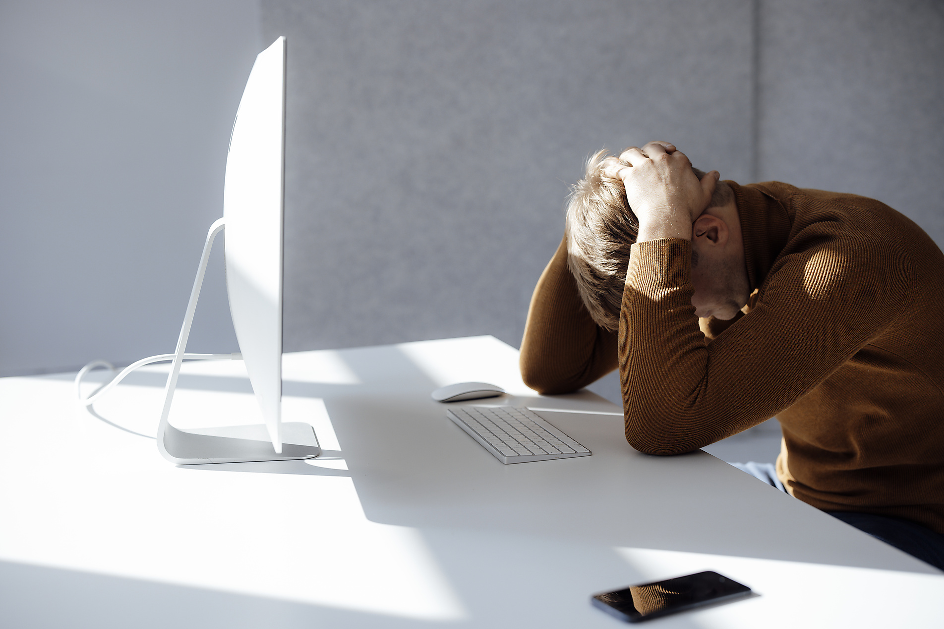 stock image, royalty-free, new work, Businessman sitting with hands behind head at desk in office